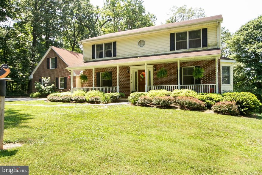 SERENE SETTING*Phenomenal Home nestled on 2.04 acres.Features 3 Bdrs.3 Full baths,Liv/Din Rm,Huge Open Kit. w/new stainless steel appliances.Den could be 4th BR* Sunroom overlooking new 35' X14' deck.New Vinyl siding, shutters,new Bryant HVAC.Family room w/Brick FP hardwood floors w/built ins.Laundry room,Wired for generator,Master suite w/bath.Fully fin.walk out level basement.2 sheds*3car garage