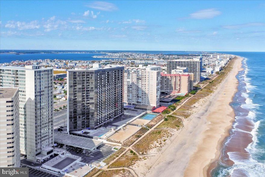 Perched atop one of Ocean City’s most sought after oceanfront buildings, this exceptional penthouse in The Quay Condominium is a true showstopper. Completely reconfigured and remodeled from top to bottom, this rare 2 level residence offers a refined coastal lifestyle with breathtaking, unobstructed ocean views from nearly every angle.

From the moment you step inside, you’re greeted by dramatic floor to ceiling windows that flood the space with natural light and showcase the sparkling Atlantic. The open concept main level is designed for both relaxation and entertaining, seamlessly blending the living, dining, and kitchen spaces. The stunning kitchen is a centerpiece, featuring stainless steel appliances, a double oven, open shelving, ample cabinetry, and a striking full height backsplash that elevates the entire design. The dining area comfortably accommodates a large table, perfect for hosting gatherings by the sea.

The living room is equally impressive, bright, airy, and anchored by panoramic ocean views, with direct access to the private balcony where you can soak in the sights and sounds of the shoreline.

The primary suite, located on the main level, is a serene retreat that truly feels like a vacation every day. Thoughtfully designed with incredible décor, including eye catching palm leaf wallpaper, this space is highlighted by a full wall of windows overlooking the ocean. A spacious closet and a beautifully designed bathroom with a separate changing area complete the large suite (20'0"× 12'3").

Up the spiral staircase, the second level continues to impress with a lofted hallway that carries the stunning ocean views upward through the expansive windows. Here you’ll find a convenient laundry closet, two additional bedrooms, and a full bathroom. One guest bedroom features a unique wall cutout, offering a glimpse of the ocean (16'2" × 13'4"), while the other is fully oceanfront and impeccably styled ( 12'8" × 12'2"). The bathroom is equally well appointed with tasteful finishes and ample storage.

Every inch of this home has been carefully curated, from the flooring to the lighting fixtures, creating a cohesive, high end coastal aesthetic where no detail has been overlooked. This unit also has strong rental potential. 

Residents of The Quay enjoy a wealth of amenities, including both oceanfront & heated indoor and heated outdoor pools, an arcade, meeting rooms, a ping pong room, tennis/pickleball courts, outdoor showers and secure front lobby access, all in a prime Ocean City oceanfront location. The Cafe is open on the 2nd floor during peak season for food, ice cream, coffee & more! The lobby has been updated and the entire building's exterior is in the process of a full recoat/painting. 

This is a rare opportunity to own a truly one of a kind penthouse that perfectly blends luxury, comfort, and unmatched views!