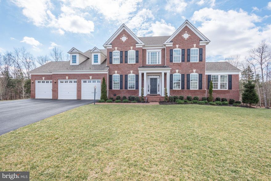 Elegant Brick-Front Estate Home on Cul-de-Sac;  Colton Model/Built in 2014.  Premium Wooded .62 Acre Lot Backing to Parkland, Beaverdam Reservoir & Conservancy.  Upgraded 3-Levels: Stunning Main Level w/Wide Plank Hardwood Floors, Dramatic 2-Story Foyer & 9' Ceilings.  Separate Formal Liv/Din RMs, Sun RM, Library/Office, Family RM w/2-Sided Fireplace & Large Windows Overlooking Wooded Area.  NEW Chair Railing, Shadow Boxing, Fresh Custom Paint, Recessed Lighting, Whole House Audio System & NEW Lighting Fixtures.  Gourmet Kitchen w/Granite Counters, Upgraded Cabinets, Over/Under Cabinet Lighting, Custom Backsplash, Upgraded SS Appliances & Large Kitchen Island, Butler's Pantry, Large Food Pantry & Mud RM w/Access to Garage.  Adjacent Sun-Filled Solarium w/Access to Large New Trex Deck w/Covered Porch Overlooking Private, Panoramic Green Space.  Stairs to New Patio, Landscaped Yard & Play Set.  Upper Level: Hardwood on Stairs & Landing w/NEW Carpets in all Bedrooms & Crown Molding.  Luxury Master Bedroom Suite w/Sun-Filled Sitting Area & Dual Sided Wrap Around Walk-in Closet.  Luxury Bath w/Frameless Shower & Rain Forest Shower Head & Soaking Tub w/NEW Cabinetss, Faucets & Lighting.  Bathroom Vanities: NEW Cabinets in Princess Suite & Hall Bath w/Spacious Bedrooms & Walk-In Closets.  Upper Level Laundry RM w/Cabinets, Granite Counter & Linen Closet.  Light-Filled Lower Level w/Luxury Features: Spacious Open-Floor-Plan w/Direct Walkout to Elegant Patio, Private Yard & Wooded Lot w/3-Separate Sliding Glass Doors & Multiple Full Windows.  Large Rec RM, Gourmet Kitchen w/Breakfast Bar, Spacious Media RM, Guest Suite or 5th Legal Bedroom w/Large Walk-In Closet.  2-Full Upgraded Baths, Bonus RM/Storage RM & Second Laundry RM.  Exceptional Outdoor Living: Perfect for Entertaining: Full-Length Patio Covered by Trex Deck Sealed Underneath & Fully Wrapped in PVC.  Provides 3-Season Living w/Fire Pit, Exterior Lighting & Surround Sound.