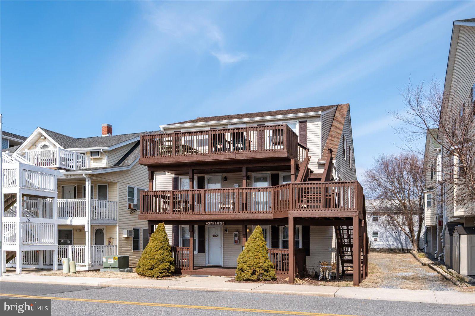 Discover this 2-bedroom, 1-bathroom ocean block unit, just a short walk to the beach! This cozy, mid-town gem offers a front porch to relax on after a day of sun and surf. Located across the street from the convention center, and within walking distance to mini golf, restaurants, bars, and shops, this perfectly positioned unit is an excellent investment opportunity or ideal beach getaway. Low condo fees! Schedule your showing today!