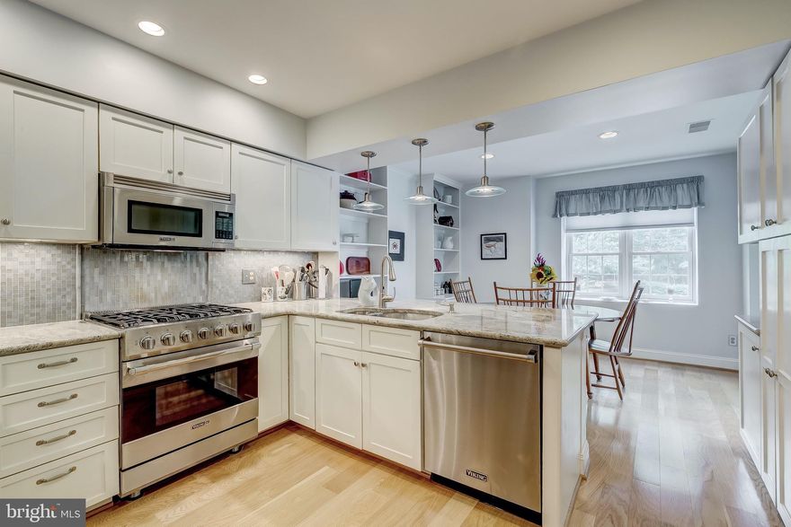 The finest details in all areas of this gorgeous garage, elevator, secure condo! Viking stainless appliances, granite countertops, fully renovated master and hall bathrooms, engineered hardwood flooring, deeded parking space, built-ins and fine finishes.  Enjoy cooking on your 5 burner Viking gas stove and work seamlessly with the touch-less faucet.  Natural sunlight makes for a cheery eat-in kitchen offering built-in storage and easy porch/balcony access through replaced slider door.  Display your finest art in the dining room with added accent lighting or over the living room's fireplace mantle.  Each bathroom offers built-in tiled shower shelving and design detailed doors.  Everything you want in "move-in ready" plus lower level additional storage. Welcome Home!