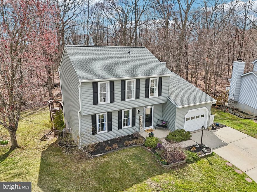 Welcome to this 4-bedroom, 2 full and 2 half-bathroom home with major updates inside and out! Ideally situated at the end of a cul-de-sac, offering privacy and breathtaking views of the serene woods and stream! 
Upon entering, you'll be greeted by durable LVP flooring that extends from the foyer into the kitchen. The updated kitchen showcases a breakfast bar, sleek stainless-steel appliances, a wine/beverage fridge, and beautiful granite countertops. Generous cabinetry — including two storage towers and a pantry — provides superb storage space.
From the kitchen, step out onto the expansive deck, perfect for outdoor dining or simply relaxing while surrounded by nature. The breakfast room’s large double window fills the space with natural light and frames peaceful views of the wooded landscape.
The bright and inviting family room features skylights, a vaulted ceiling, and a cozy wood-burning fireplace, with an open flow to the kitchen.
At the front of the house, a flexible room with hardwood flooring can easily function as a living room, dining room, or office — tailored to suit your needs.
The upper level offers a spacious primary ensuite with dual closets, along with two additional generously sized bedrooms, all equipped with ceiling fans. The hallway includes an upper-level laundry for added convenience. A linen closet and hall bath with a tub/shower combination completes this level.
The lower level provides additional living space with a sizable rec room featuring a sliding door to the backyard. This level also includes a secluded fourth bedroom (or office) with a full-sized window. A full bathroom with dual access from both the bedroom hallway and the rec room adds further convenience
Recent updates include- vinyl siding, roof and skylights in 2023. Complete basement remodel 2023, HWH 2024, carpet 2022. Rare .25 Acre lot!
Combining comfort, privacy and scenic views, this home offers an exceptional lifestyle in Sought after Southampton!