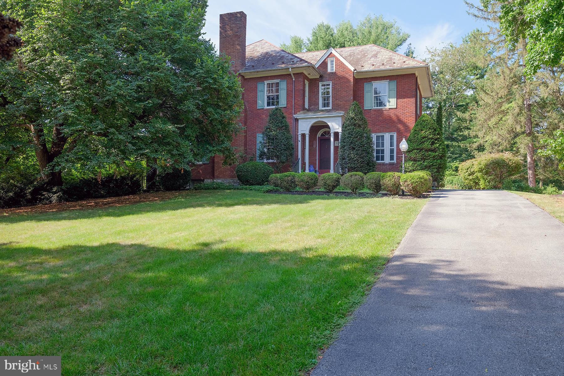 Classic all-brick Colonial featuring 4 bedrooms and 2.5 baths—truly a timeless gem! From the moment you enter the foyer, you'll feel the character and warmth of this cherished home. The spacious living room offers a cozy fireplace and access to a charming brick-covered side porch, perfect for relaxing. Enjoy formal meals in the elegant dining room with a built-in china cupboard. The main level also includes a library, an eat-in kitchen with exposed wood-beamed ceiling, built-in desk, and pantry. A convenient first-floor half bath includes a laundry area and a large window overlooking the beautifully landscaped gardens. Hardwood floors flow throughout the home. Upstairs, you'll find four bedrooms, including a primary suite with an adjoining sunroom. The fully floored attic provides excellent storage or potential for expansion. The lower level offers a game room and additional storage. Step outside to discover a "Secret Garden" backyard—extremely private, with a charming serpentine wall and professionally designed landscaping. A detached two-car garage completes the package. Located just minutes from shopping, Gordon’s Groceries, and neighborhood sidewalks lined with historic streetlights—ideal for evening strolls. This home has been lovingly maintained by the same family for generations and is now being sold to settle the estate. Don’t miss this rare opportunity in the sought after North End, with wonderful neighbors, too!"