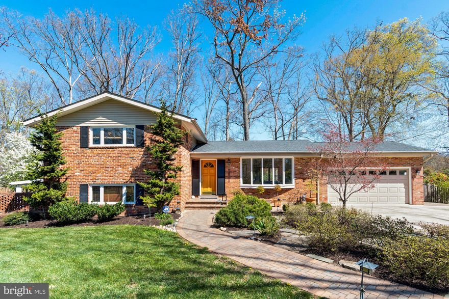 Welcome home to an Oasis in the suburbs.  Beautifully landscaped yard welcomes you to this 3 bed 3 bathroom remodeled home. Open floor plan boasts vaulted ceilings and lots of natural light.  Gourmet kitchen with Stainless steel appliances and  granite counter tops.  Klipsch built-in audio speakers in the family room ceiling for movies and music. Spacious living room and dining room with hard wood floors.  Arts and crafts style wooden doors throughout the house. Upstairs 3 bedrooms with hard wood floors.  Separate master bath and hall bathroom with tile. Downstairs has inviting family room, laundry room, a third bathroom, and plenty of storage in built-in cabinetry.  Wood burning fireplace and radiant heated floors on the lower level keeps you warm and cozy.  Built-in office desk with granite and cabinets makes it a great place to tele-commute. Large added Sunroom for relaxing. Walk out to extra-large landscaped yard with sprinkler system and landscape lighting. Beautiful paver walk-way with stacked stone gardens in the front and back yard.  Fenced back yard with large patio and stack stone gardens. Great place to entertain or relax. Large custom 2 Car garage and plenty of driveway space in a tree filled community close to George Washington Parkway with easy commutes to Belvoir, Old Town and DC.