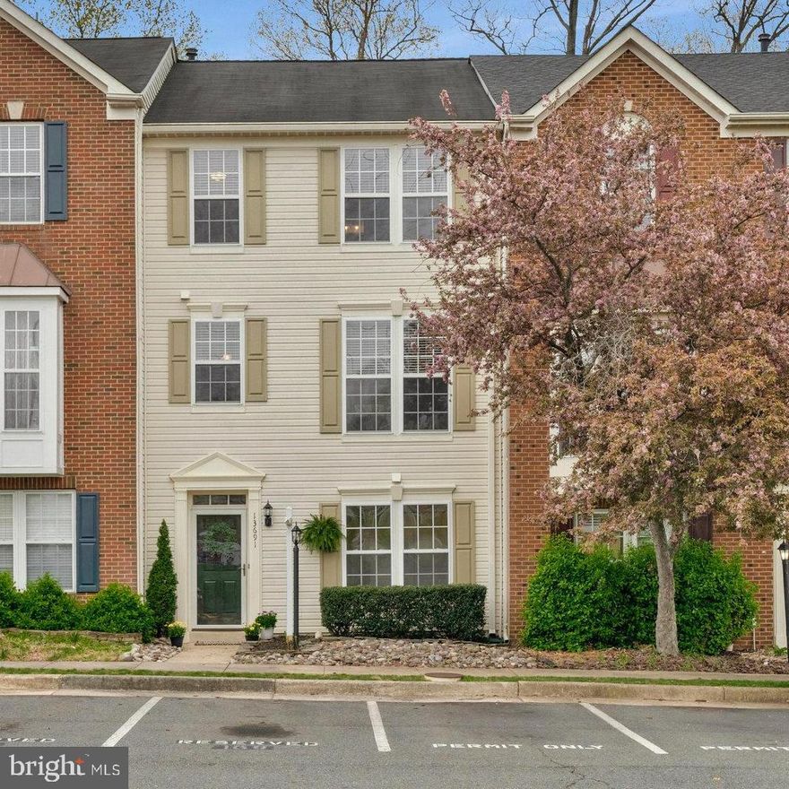 Welcome to a rare opportunity to own a beautifully updated, privately situated townhouse that truly has it all—comfort, convenience, and charm. With a BATHROOM ON EVERY LEVEL, this spacious Northeast-facing 4-bedroom, 3.5-bathroom home features a 3-level bump-out, providing extra room to live, work, and entertain in style. Step inside and you’ll immediately notice the fresh updates—new paint throughout, brand-new carpet, and gorgeous luxury vinyl plank wood flooring on the main level. The open-concept floor plan is filled with tons of natural light and perfect for everyday living or hosting friends and family. Enjoy a sun-drenched kitchen with pantry and lighted glass-front cabinets, a bright and inviting sunroom/dining room, a spacious living room, and a convenient powder room— all on the main level. Upstairs, retreat to the oversized primary suite with a large walk-in closet and a spa-like bathroom featuring a double vanity, soaking tub, and separate shower. Two additional bedrooms, a full hallway bath, and linen storage complete the upper level. Downstairs, the lower level offers incredible flexibility with a fourth bedroom, another full bathroom, a laundry/utility room, and a large family room with walkout access to the backyard—ideal for guests, a home office, or additional living space. Enjoy morning coffee or evening relaxation on the private deck that backs to serene trees, and take in the open views from the front of the home for even more peace and privacy. Two reserved parking spots are right out front, and you’ll have a guest pass, too! This beautiful home is upgraded with the K Guard Gutter System which includes extra large 6” gutters that are virtually maintenance free! Ideally located within walking and biking distance to the Innovation Center Metro stop (1.3 miles) and Coates Elementary School (0.5 miles), and Giant grocery store (0.6 miles) this home offers the perfect blend of location, space, and everyday convenience. And notice how low the monthly HOA fee is compared to others! Whether you’re commuting, running errands, or walking the kids to school, everything you need is just steps from your front door.