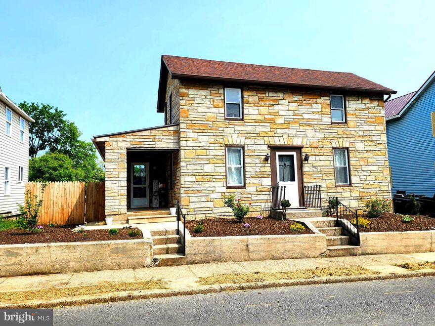 NEW PRICE!!!   This charming stone home features three bedrooms and one bathroom. It boasts a covered porch at the front and a rear deck, perfect for relaxing or entertaining outdoors. The main level showcases beautifully refinished wood floors, adding a touch of elegance to the living space. New flooring in kitchen and mud room!  Additionally, the property includes a convenient one-car garage for parking or storage.

Inside, you'll find a decorative fireplace that adds character and warmth to the home. All Appliances convey!  The location is highly desirable, as it is close to all amenities, making shopping, dining, and other conveniences easily accessible. Furthermore, the rear yard is fully fenced, providing privacy and security for you and your loved ones.

Overall, this home offers a blend of attractive features, both inside and out, making it a great place to call home.  Schedule your appointment today!