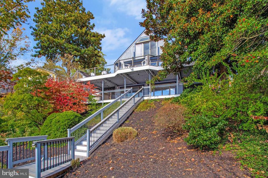 Experience waterfront living in this exceptional 5 bedroom, 4 1/2 bath home, perfectly positioned to capture breathtaking panoramic views of the South River and unforgettable sunsets. Designed for comfort and style, this residence features an open-concept layout with a spacious living room highlighted by a stone wood-burning fireplace. The kitchen boasts a very large granite island with seating. The sitting area just off of the living room is the perfect place to reflect while taking in the sparkling water views.
The primary suite offers a luxurious escape with a spa-inspired bath and stunning river views. Two bedrooms and 1 1/2 bath on the main level are perfect for overnight guests. Spacious finished lower level with full bath, fireplace and walk out to waterside decking perfect to extend entertaining outdoors. A protected private pier with deep water, multiple slips, and a jet ski lift invites endless waterfront adventures. The dock can accommodate a sailboat at the end of the pier or the big slip. This South River waterfront is truly one-of-a-kind. Property is available furnished or unfurnished. Landlord will consider including all utilities and furnishings for $7500 per month.