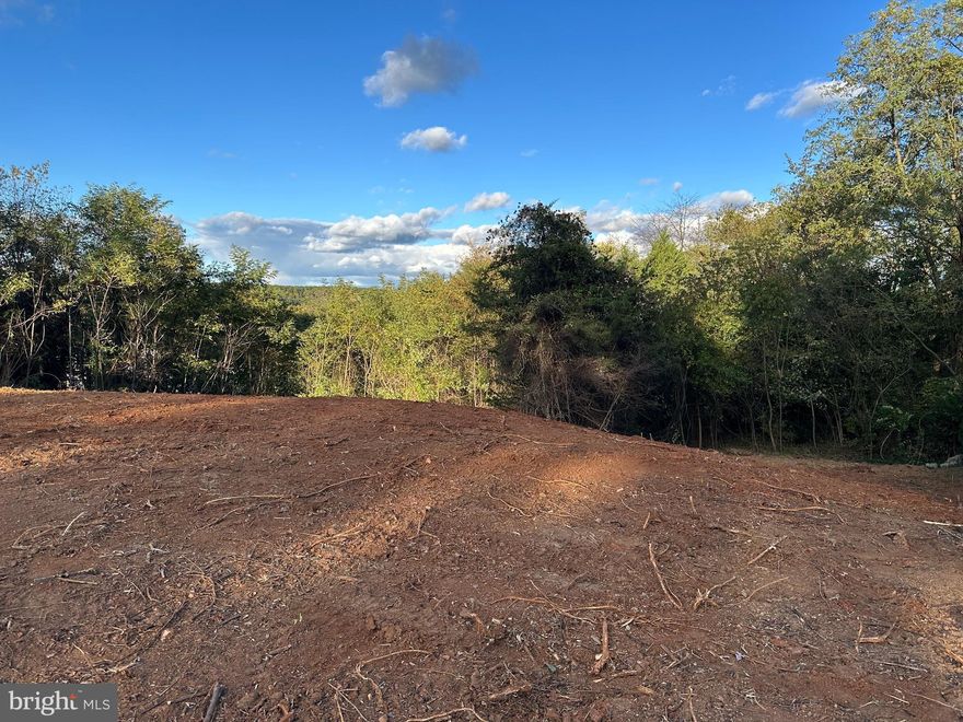 Nice Building Lot with Views perfect for walk out basement.  Build your dream home on the .377 acre lot on a culdesac with mountain views after a little clearing.  Municipal Water and Sewer taps have already been paid.  Great place to build!