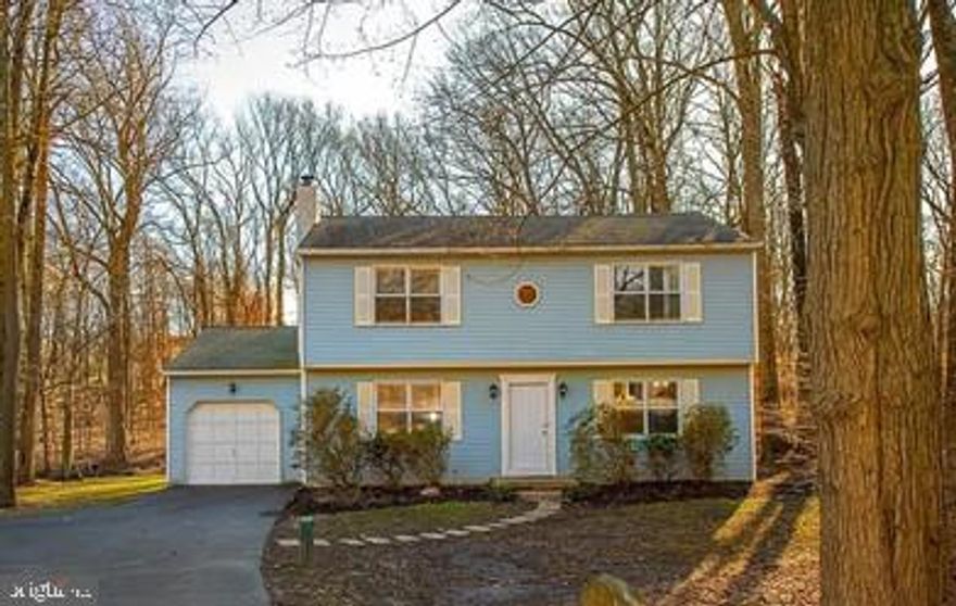 Welcome home to 1513 Winding Brook Run!  This spacious 4 bedroom 2 1/2 bath Colonial  sits on 1.4 acres in a park-like setting - and it's convenient to commuting routes, schools, and shopping.  Enter through the front door into your formal living room with recessed lighting which flows into the formal dining room featuring hardwood flooring. The dining room opens to an amazing sunroom with windows on 3 sides, and sliders leading to the deck overlooking your spacious back yard, forested section, and scenic Naaman's Creek. The Eat-in kitchen with  new stainless appliances  opens to a generous family room with built-in corner cupboard and wood stove.  The main floor Laundry Room and a Powder Room are convenient just steps away on the Main Level. The second level offers a Master Suite with walk-in closet and fully renovated bathroom. Three additional bedrooms and fully renovated hall bath finishes the second floor.  Fresh paint and hardwood floors throughout.  One-car attached garage with built-in workbench plus plenty of driveway parking. Don't miss the amazing updates just completed in March to include:  Heat Pump installed, new water heater, well pump and tank installed, garage and kitchen windows replaced, new toilets and tubs and  so much more.  If you're looking for privacy and convenience, you've found it. Make your appointment today!