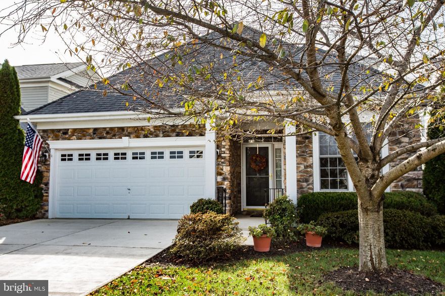 EXCEPTIONAL Stone front home offers beautiful Main Level Living with gorgeous wood floors, sunny Great Room w/ Kitchen and 3BR/3 BA.  Plus, flex room, fabulous Loft Suite with large BR & Full BA & Liv/Dine area. Plus, many extras like double hung windows,lower cabinet pullout trays,custom blinds. Perfect downsizing  in beautiful, 55+ Virginia Heritage! Close to Publix, hospital and shopping