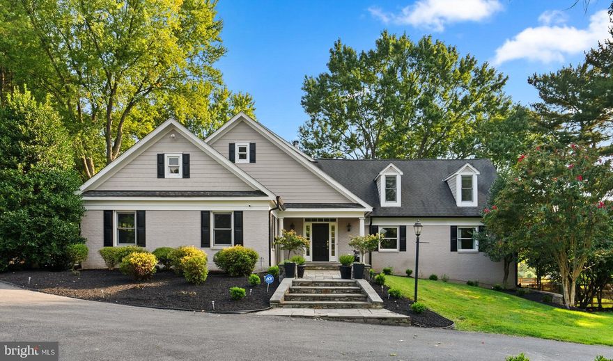 5 miles from the Potomac Village, 12810 Glen Road is a unique estate blending tranquility and modern comfort. Located within the highly acclaimed Wootton High School cluster, this home underwent a complete rebuild in 2006 and received a refreshing update in 2024.

Spanning 8,327 square feet, this residence contains oversized rooms, gleaming hardwood floors, modern yet classic updated lighting and flexible use spaces.  The interior has a crisp and clean aesthetic; entirely painted in a fresh white hue during the fall of 2023. 

The 8-foot wide entry hall flows past the wainscot adorned formal dining room and french doors that open into a private office to the great room. Arguably one of the most beautiful rooms, the enormous great room has picturesque views of the back 5 1⁄2 -acres, a stone surround gas burning fireplace (converted in 2024), and access to a deck leading to the side yard. 

The gourmet kitchen contains top-of-the-line stainless steel appliances, including a 6-burner gas cooktop with pot-filler and double ovens. The oversized island has a prep sink, wine refrigerator and seating for four. The kitchen seamlessly blends into a breakfast room with an exit to a  screened-in porch and flagstone patio. 

The main level also features a spacious bedroom suite with a walk-in closet finished with built-ins and bathroom with double vanity sink and bathtub. The ensuite bathroom has customizable lighting options for hanging pendants or over mirror vanity lights. The additional bedroom has double closets and access to the attached full bath (also accessible from the hallway).  A convenient mudroom/laundry area and half bath are located between the kitchen and garage. The mudroom has built-in cabinets and a utility sink as well as a side door to the driveway. The large, two car garage has built-in storage. 

The second floor features a sprawling primary suite with a gas fireplace, wet bar with sink and beverage refrigerator. The primary bath has a 4x8 shower with three shower heads and bench seat, a Bain Ultra air tub with jets and lights, and Emperador marble counters. The primary closet is not an ordinary closet but a room in and of itself with two separate walk-in areas and additional space that has the potential for customized built-ins. 

The landing on the second floor is generously proportioned, providing space for a sitting room or library area, with an adjacent hallway that can be utilized as a study area or activity space. Two additional bedrooms and a hall bath complete the second level.

The lower level has plenty of space for entertainment and relaxation, with 9-foot ceilings and a copper-topped bar with a sink, beverage refrigerator, full-size dishwasher, and built-ins for glassware, beverages and decor. This level also includes a recreation space, full bath and a bonus room with a closet. A separate area that can be used as an apartment or catering area provides additional functionality with a full-size refrigerator, double ovens, a 2-burner cooktop, a second washer/dryer, a wine storage room, and two utility/storage rooms.

Outside, the front of the home has an extended driveway and manicured lawn.. The immediate exterior features a flagstone walkway, back patio and side deck. The highlight of the outdoor space is the private 5-acre backlot, featuring a professionally maintained pond that can be stocked for fishing, a path encircling the pond, an 80 x 200 ft flat area primed for any type of sports court or pool adjacent to an 52 x 20 ft structure with insulated roof, running water and updated electricity, ready to be transformed into a pool house or sports clubhouse. The back 5 acres is enclosed by exterior fencing and the immediate backyard has brand new fencing. The 7.6 acres are made from two lots (12810 and 12812) being sold together. Currently, the property is a working horse farm and can be easily utilized as such. 

Please review noteworthy improvements and home facts available in the document section.