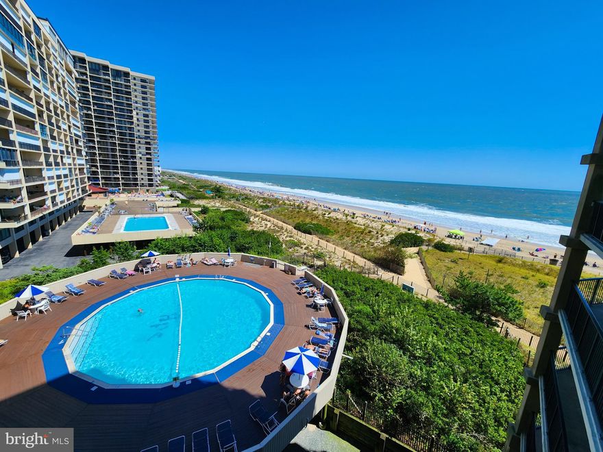 This spacious 1 bed 1 bathroom ocean front condo feels open, airy and displays beautiful unobstructed views of the Ocean. Just renovated, this condo boasts a new kitchen, flooring, furniture and an updated bathroom. HPS is one of the longest standing condo buildings in town. Association dues include basic cable for the condo and 3 parking passes. The home is vibrant with light and has a large private balcony to enjoy the views. Laundry, split duct system, and stainless steel appliances are new as of 2025. LVP flooring is waterproof and scratch resistant for coming right off the sand. The beach is within reach in this amazing condo.