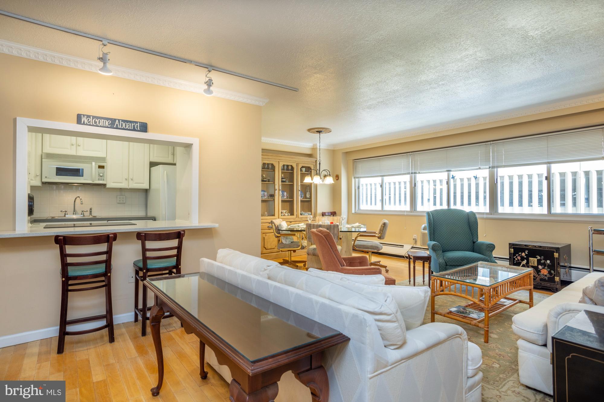 This is an opportunity to own an Upraded two-bedroom home in the Rittenhouse House Square neighborhood for a very reasonable price and to have low monthly housing expenses. This is a north facing unit at Penn Center House, which is a Co-op building. The home has large scale rooms, lots of windows and great light. The entry vestibule leads to a large open living room with a dining room area and a pass through to the kitchen with an overhanging counter for seating. The kitchen was renovated and has French doors, contemporary white cabinets, and appliances. The bathroom was also renovated and has a stall shower with framed glass doors. There is a lot of closet and storage space, including two large walk-in closets, a standard bedroom closet in the second bedroom, a linen closet, and built-ins in the laundry room. The full-size washer and dryer are in a separate room behind a custom cabinet. The owner would like to sell the home partially furnished. The monthly fee includes heat, air conditioning, electric, water, basic cable and real estate taxes. The building has 24/7 building access control, on-site maintenance staff, management office, fitness center, community room, library, roof-top deck, guest suite and common laundry room. The fitness center has an annual fee of just $125. There is an on-site parking garage available ($145 per month) that is one of the best deals in the city. The Penn Center House is located just a few blocks off Rittenhouse Square, which has some of the best restaurants, shopping, and nightlife in the city. There are many public transportation options within a few blocks. The Suburban train station is a block from the building. There are multiple bus routes within a block of the building and Amtrak’s 30th Street Station is just a few blocks walk. The Schuylkill River trail, museums, University of Pennsylvania, Drexel University and Children’s Hospital are all within easy walking distance.