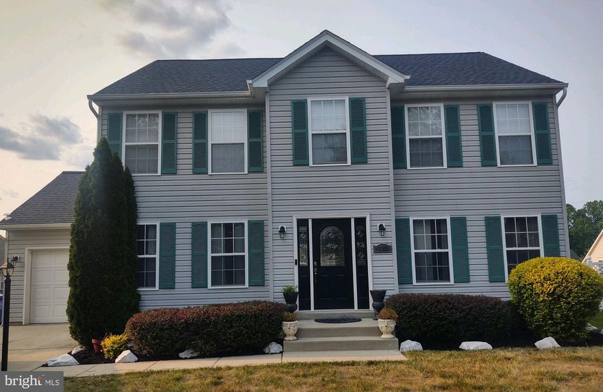 Beautiful 5 bedroom/3.5 bathroom detached house with one car garage, in the Rolling Meadows subdivision (No HOA) shows like a model; fully updated & upgraded - new roof and appliances; the main floor holds a formal dining room, office/library, half bath, large gourmet kitchen with black cabinets, quartz backsplash, a deep cast iron double sink, an island, ceramic tile floors, and granite counter tops, stainless steel appliances, room for more dining and opens up to a large living room; upstairs are 4 well sized bedrooms and 2 full baths; the primary suite's bathroom has a soaking tub, double sinks, closet & separate shower; the fully-finished basement has another bedroom and full bath, laundry room with bar and shelving, washer, dryer, refrigerator and separate entrance for entertaining and rental possibilities; the large fenced backyard has a deck and paved patio. 
Conveniently located to shopping, restaurants, parks, Routes 5, 110, and 301.