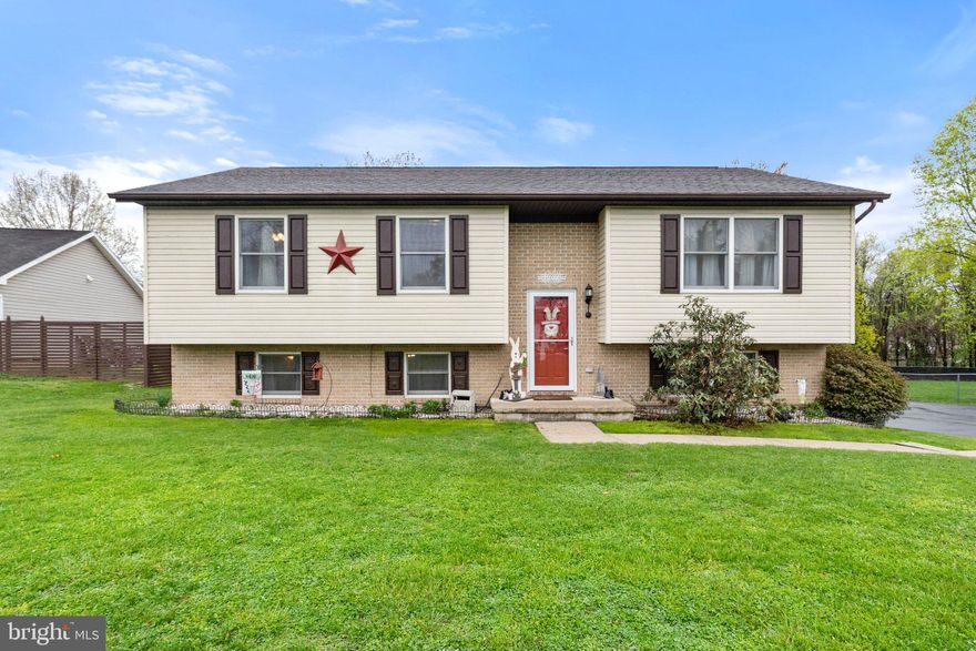 Welcome to this lovingly maintained split foyer home in the quiet Spring Valley neighborhood! Featuring 3 bedrooms on the main level and a fourth bedroom on the lower level, this home offers plenty of options to spread out. The updated kitchen boasts stainless steel appliances, a stylish backsplash, and ample cabinetry. The inviting living room flows seamlessly into the dining room, where you’ll find access to the 10' x 16' screened-in porch—the perfect spot to relax while overlooking the fully fenced spacious backyard. The primary suite is a true retreat with a tastefully updated ensuite bath, while two additional bedrooms share a well-appointed hall bath. Downstairs, the lower level is ideal for entertaining, with a spacious family room to the right that also had a pellet stove to keep you warm during those wintry months and a game/rec area to the left, offering easy backyard access. A fourth bedroom is also located down here as well as a half bath.  To finish out the lower level there is a laundry room with front loading washer & dryer.  Outside, the detached 2-car garage includes a large loft space for extra storage, and the extended driveway provides ample parking. Don’t miss the chance to make this charming home yours!