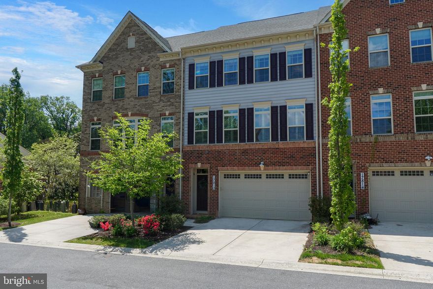 Welcome to 17812 Thomas Village Lane, where thoughtful design, modern comfort, and small-town charm come together beautifully. Meticulously maintained and built in 2018, this inviting 3-bedroom, 2 full and 2 half bath townhome reflects the owners’ intentional attention to detail at every turn.

The heart of the home is the stunning gourmet kitchen, designed for both everyday living and effortless entertaining, featuring a large center island with abundant seating, stainless steel appliances, gas range with hood ventilation, under-cabinet lighting, generous cabinetry, and a spacious pantry. The kitchen opens to a light-filled living room with access to the rear deck, while the adjoining dining area and main living spaces are enhanced by hardwood hickory flooring, custom lighting, and elegant plantation shutters throughout. A main-level powder room adds convenience for family and guests alike.

Upstairs, the spacious primary suite offers a relaxing retreat with two custom-designed walk-in closets and hardwood flooring throughout the upper level. The en suite bath features a double vanity and thoughtful shower upgrades, while two additional generously sized bedrooms, a well-appointed hall bath, and upper-level laundry provide comfort and functionality.

The walk-out lower level offers a versatile recreation room with upgraded flooring, plantation shutters, a half bath, extra storage, and access to the two-car garage. In 2024, the entire interior—including walls, ceilings, and trim—was repainted with premium Sherwin-Williams Emerald paint, reflecting the exceptional care throughout.

Set in sought-after Thomas Village, this home offers the charm of Sandy Spring with the convenience of walkable shops and dining, nearby breweries and local attractions, top-rated public and private schools, and easy access to Olney, Washington, DC, Baltimore, Howard County, and central Montgomery County. A beautifully curated, move-in-ready home in an exceptional location, 17812 Thomas Village is sure to turn heads and make for a happy place to call home!