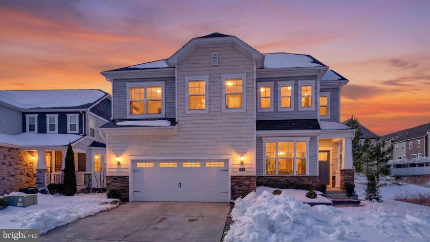 Absolutely beautiful Portfield Model built by Lennar is available for sale. This home will be sure to impress!!! Packed will upgrades and thoughtful details! LVP on main level (tile in the office) and also upper level. Gorgeous kitchen features white cabinets, granite countertops, SS appliances, oversized island, walk in pantry. Breakfast area. Bright and airy sunroom that can be used as formal dining room.
Specious family room with cozy fireplace and beautiful stone around it. Primary suite features tray ceiling, spa like bathroom ( dual vanity, soaking tub, shower with the bench) and walk in closet. 3 more good sized bedrooms, additional full bath, laundry and loft area which is perfect for additional living space, homework area or office. Fully finished basement and full bath! Backyard is true outdoor oasis with upscale stone patio, firepit, outdoor kitchenette and sitting wall. Fully fenced in. There are also beautiful stone elements in the front of the house. Access points for strong Wifi connection. Resort style HOA amenities - waterfront pavilion, kayaking, pier, walking trails, playground, dog park, outdoor pool, clubhouse, gym. Conveniently located near shopping, dining, major highways. Short drive to Fort Meade, NSA, National Business Park, Baltimore downtown, Annapolis.