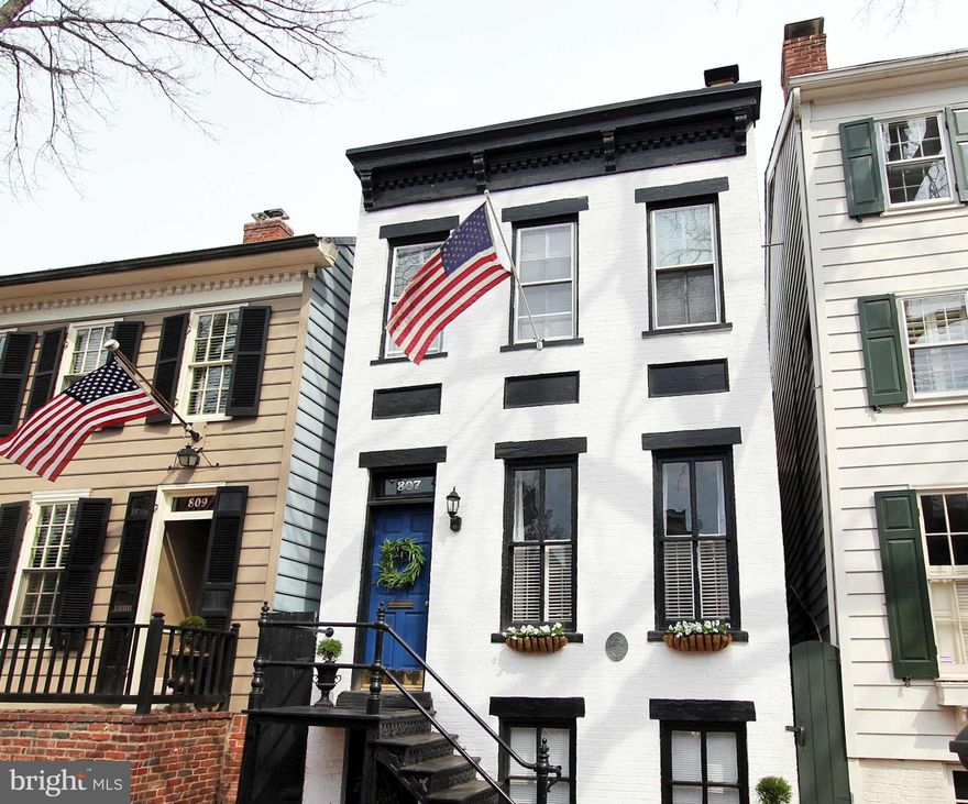 Charming historic home 2 blocks to King St. Features bright, open living & dining rooms. Newly renovated kitchen with white shaker cabinets, subway tile backsplash, quartz counters & stainless steel appliances. Large renovated bath with Carrara marble vanity. 2 wood burning fireplaces & antique heart pine floors. Finished lower level with private front entrance. Huge garden & off street parking.