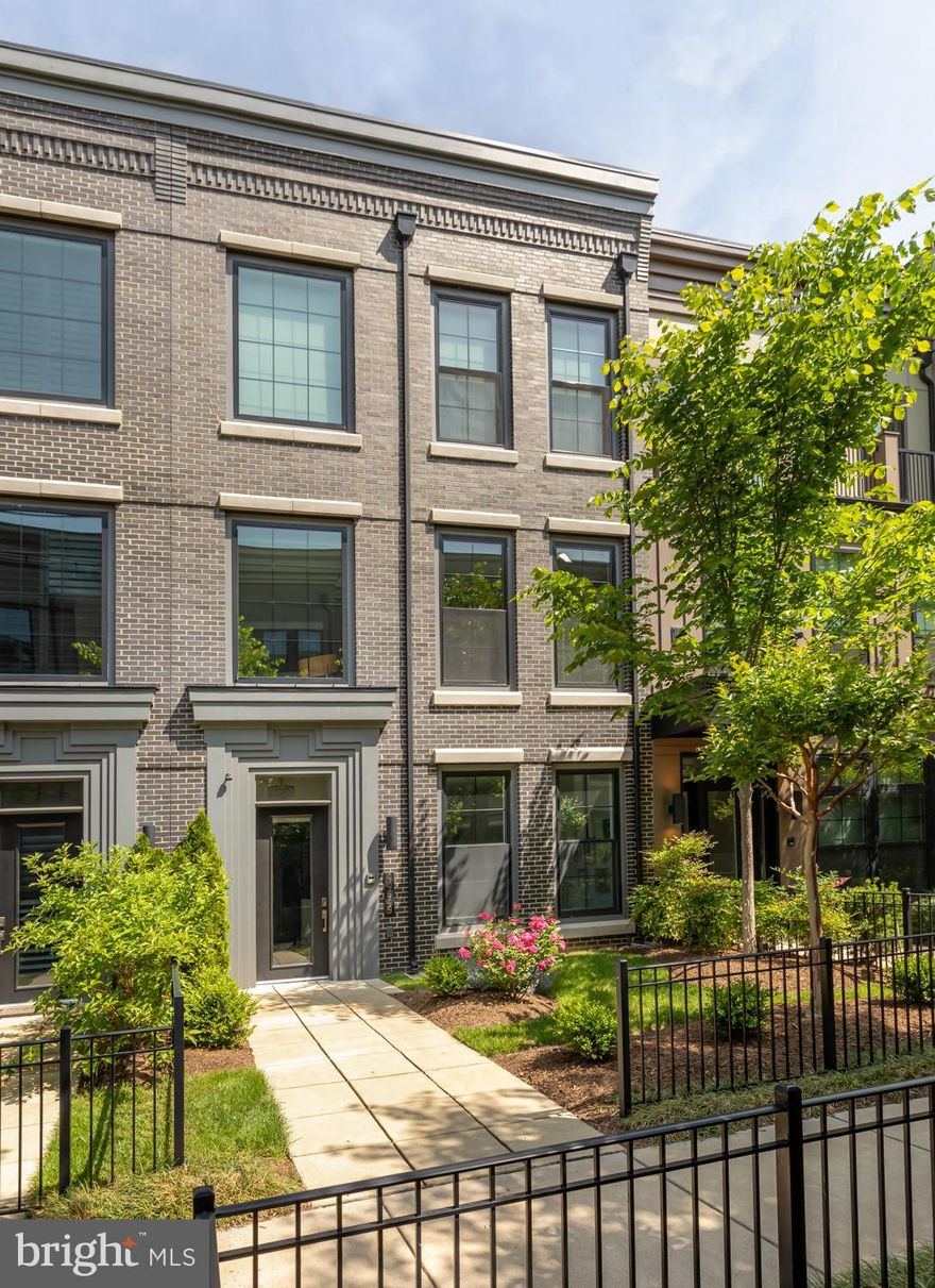 This is modern luxury in One Loudoun! With modern design and high-end finishes, this four story elevator townhouse (4,300+ sq/ft) in One Loudoun provides all the luxuries you could ask for in the heart of an expanding urban development in Loudoun County. The main living level offers an unparalleled open concept with soaring ceilings and bright windows illuminating the level from front to back. The kitchen is appointed with high-end cabinets, quartz countertops & backsplash, 6 person seated island, and Subzero/wolf appliance suite. The expansive island commands attention with so much room for entertaining and dining. The living room features huge windows and modern linear fireplace. Retreat to the owner’s suite with huge walk in closet and owner’s bath. Laundry room is conveniently located in between all three bedrooms on the third floor! The fourth floor is the place to be! A large rec room greets you while looking out onto the large rooftop terrace. An additional bedroom and full bath is just off the 4th floor rec room. The entry level is a great flex space for a home office or formal living room. Fantastic open space - 10 ft ceilings on 3 levels and 9 ft ceiling on the terrace level. Home features Anderson Black Framed Windows, smart garage door and Two High Efficiency HVAC systems. Now all of this is right in One Loudoun so you can enjoy everything the community has to offer!