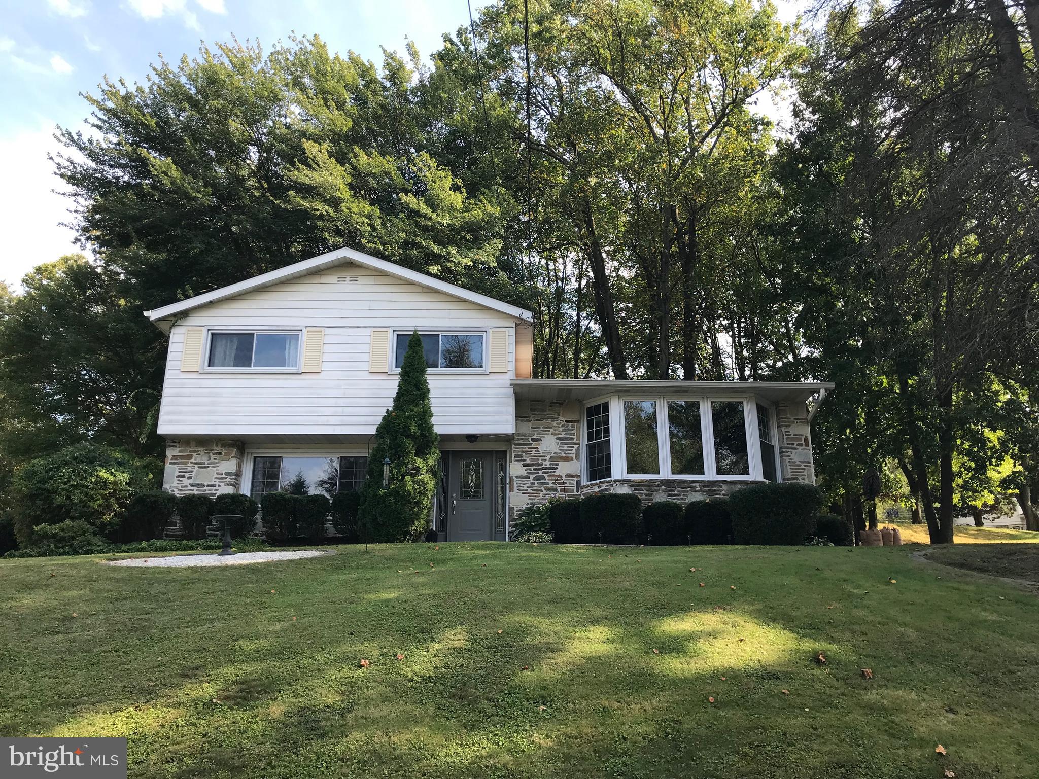 Spacious 3 bedroom home located in sought-after Upper Dublin Township.  This 3 level home offers a formal Dining Room, Family Room, Updated Eat-in Kitchen, and oversized Laundry Room.  The kitchen provides white cabinets, gas cooking, counter lights and hardwood floors with easy access to the backyard.  Large windows throughout the home let in a ton of natural light that is sure to delight.  Downstairs you will find a large Family Room with access to the yard, Laundry Room and half-bath.  The Laundry Room is over-sized and also can be used as a Mud Room since it also has access to the backyard.  The Master Bedroom also offers a Master Bathroom with a stand-up shower and plenty of space.  A one-car garage is attached to protect your vehicle or for additional storage space.  There is even a basement that can also be used for storage.  Outside you will find a half-acre lot that is partially wooded.  Perfect for the family to run free and to enjoy fires around the fire pit in the evenings.   Come and check this home out - it won't last long!