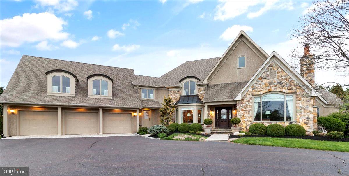 Welcome to this majestic estate in Bucolic Bucks County. Custom built home on 3.80 acres in Bedminster Twp. This estate home includes 4 bedrooms, 3 upstairs all with full baths and a first floor main bedroom. The main bedroom includes a full bath with large shower and jetted tub, double sinks and walk-in closet. There is a French door that opens onto the covered back porch the perfect place to sit and enjoy a morning coffee or at sundown a glass of wine. The gourmet kitchen is just waiting for a new chef. It has double ovens by Wolf, a Sub-Zero refrigerator with custom wood front, a Wolf smooth top cook range and two dishwashers. This kitchen is large enough for two cooks. The breakfast bar with granite counters is a great place for friends to engage with the cook. Cherry cabinets are in abundance which makes this kitchen great for entertaining. The breakfast room surrounded by windows will be your windows to the changing seasons. The centerpiece of the family room is the floor to ceiling stone gas fireplace and the beautiful wood stairway leading to the upstairs bedrooms. A study/office with its oversized picture window with a typical Bucks County view includes a gas fireplace. Around the corner is a powder room for your convenience . The formal dining room in the front of the house includes a beautiful crystal chandelier and hardwood floors which continue throughout the entire house excluding bathrooms, laundry room and part of the finished basement. An entrance from the 3-car garage takes you into the hallway which includes a second powder room, large pantry, laundry room, and back staircase. Now on to the finished basement (approximately 1,600 sq foot finished area) which includes a full second kitchen with a stove, dishwasher, wine cooler, ice maker and a full refrigerator & freezer. The wood bar is highly polished and adds to the party atmosphere of the finished basement. There are several sitting areas allowing for large groups of family & friends. This is the ultimate party basement. There are double doors for easy access to the backyard, a powder room, exercise room, storage & utility rooms finish the lower level. There is ample room in the backyard to add an in-ground pool. Call today for your private showing. Easy access to NYC, NJ, & Phila. via RT202, RT78 & RT95 Also close to Van Sant Airport in Bucks County.