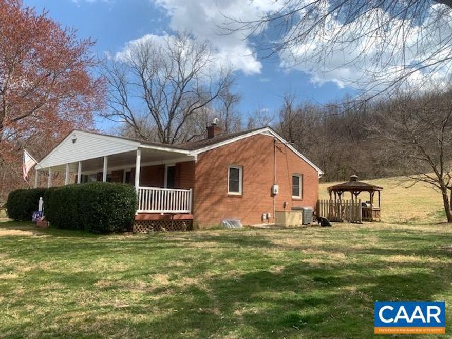 Well-maintained Rambler home with a beautiful setting on 24 Acres near Graves Mountain Lodge. Surrounded by gorgeous mountain views, this 3 bedroom 2 bath house is a very spacious 1600+ sq. ft. updated to meet today?s tastes! The kitchen includes local custom-made cabinets along with granite counters and a great layout! The full basement has a rough-in, ready to complete a full bath and increase your living space. The detached double bay garage (24×30) has both electric and water. There is more storage with a 30×32 Pole Shed and a fenced in area for several animals as well! All of this is on the front 4 acres while the ?back 20? can serve for hunting, hiking, another gazebo, etc? Come see this great opportunity!,Granite Counter,Wood Cabinets