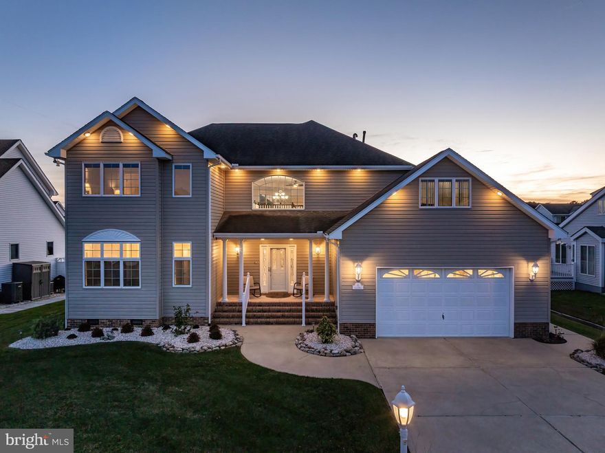 Boaters & Beach Lovers Dream!!!"Terns Landing" Coastal Style Waterfront home with beach inspired elements! Prime location with easy access to the bay and beach, this property is the ideal retreat! Your vessel awaits you on your updated boat lift with effortless access to the bay at your back door. Ease and comfort abound as you cross the threshold of this stunning 3-bedroom (with room for a fourth), 3.5-bathroom home with seamlessly flowing premium LVP flooring throughout. The bright open floor plan immediately greet you with its neutral color palette and floor to ceiling windows. Custom motorized shades and multi room audio system are  just a few  pleasures you'll find in this exquisite property. The efficient gas fireplace will serve as a picturesque backdrop to many living room gatherings, or as the centerpiece for a few minutes of solitary tranquility. Creating beautiful meals will be a joyful experience in the recently updated chef-inspired kitchen, which flows easy into the dining room and living room. Plenty of cabinet and counter space, along with an extra prep sink allows for maximum workspace and flexibility. The fashionable backsplash of ceramic tiles makes this crisp room pop! The gourmet hub is both stylish and functional with its multiply ovens and extra wine refrigerator. A generous pantry space helps keep snacking supplies out of sight. Rich with two walk-in closets for your wardrobes, the expansive primary bedroom located on the main level has a brand new private bathroom flooded with natural light and includes a dedicated makeup/hair station. A tray ceiling and glass doors to the cozy sunroom complete this restful primary bedroom. The additional 2 bedrooms, each with their own full bathrooms with skylights are both spacious and quite unique. They both have plenty of closet space, and one has a large sundeck with views across the bay--a great place to relax before turning in for the evening. On the upper level you'll also find a private office, an open loft area, perfect for a game room and entertaining and a giant storage area. The attractive, recently installed landscaping  is all the more appealing with an underground sprinkler system requiring minimal maintenance. Looking out over the landscaping, a breezy front porch is a nice spot for relaxing with refreshments, whether in solitude or among family or neighbors. Dependably crafted of composite materials, the appealing rear structure is the stage for crab feast and grilling with friends and family. An upgraded storage/workshop is found in the extended two car garage. Enjoy the Ocean Pines Beach Club located in Ocean City on 49th & 50th street where you can relax by the pool or on the beach  just steps away. The Beach Club provides a beach bar with beverages, food, live music and restrooms with showers. Or stay closer to home and visit the neighborhood yacht club with dining and live music. Installed in March of this year is a 40+ year architectural shingled roof and new skylights. This property is ideally located within the desirable "Terns Landing" section of  Ocean Pines and is an impressive beach retreat.