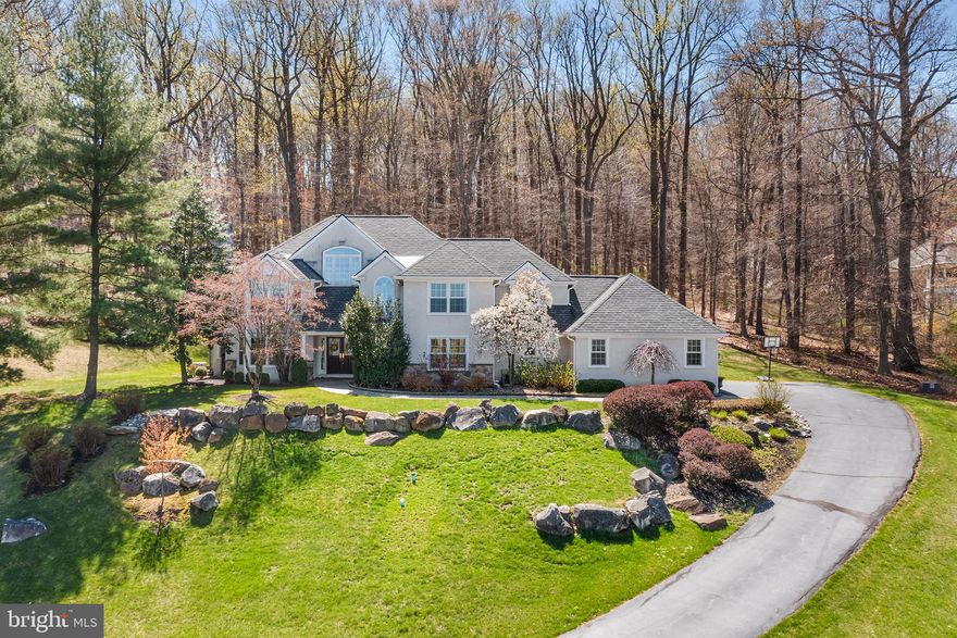 On top of the world in Valley Forge! Welcome home to 490 Freedom View Lane, sitting atop the hill in the back of the cul-de-sac with breathtaking views for miles! This home, on just under an acre of land, was originally designed by the local legend Larry Palmer of the Hunter Group, who specializes in high end, ultra custom residential homes, and has since been taken to the next level.  Fully renovated inside and out, top to bottom, it is perfection in every way. Curb appeal is off the charts here, as the beautiful front landscaping sets the tone. Head up the driveway to a large 3-car garage! Standing in the main foyer, you immediately notice the entire floor is drenched with natural light and the flow is flawless! The gorgeous, expanded kitchen, just renovated in 2021, has amazing quartz countertops, high end appliances (Sub Zero refrigerator, Wolf 6 burner range, oven, convection oven and warming drawer, and Bosch Super Silent dishwasher), an enormous island over 10 ft long, and white shaker cabinetry. A total show stopper. Don't miss the two built-in pantries and desk nook with matching cabinets and top. Just off the kitchen is a spacious dining room with large windows overlooking the amazing views, perfect for entertaining! From there, head into the two story living room with wood burning fireplace and enjoy the full length chimney and two story windows! Amazing custom wet bar with copper sink, custom shelving and incredible Van Gogh granite  completes the living room! Head out to the custom blue stone slate patio, with access from kitchen and family room, and enjoy the beautiful gas fireplace while overlooking your very private back yard. For some quiet relaxation, enjoy the sitting room with a second wood burning fireplace and newly tiled surround, and access to an extension of the patio. The front office with tons of windows, a brand new powder room with Anthropology wallpaper and marble vanity, and a large, expanded mud area with full size w/d, utility sink, and tons of custom storage complete the first floor! The primary suite on the second floor has it all, including tons of windows overlooking the horizon, a fully upgraded bathroom with large shower stall with three different controls, soaking tub with chandelier and freestanding tub filler, 80 inch double vanity, and an enormous walk-in closet with custom California Closets system, chandelier and window! Three large secondary bedrooms, one with a full en-suite bath, and a hall bath with a double vanity, round out the perfectly functional second floor. One of the coolest parts of the home is in the basement: the custom, refrigerated wine cellar with stone facade and arched door entryway! If you needed more space, enjoy an additional approx 700 sq ft of finished recreational space in the basement! Looking for a sense of community? On Valley Forge Mountain, enjoy the best of both worlds - private and quiet streets, but full of community activities. Valley Forge Mountain Association, and its local park, the Sunbowl, has  community/seasonal events and activities, community playground, and a dedicated email list to keep everyone informed. Access to join VFM Swim Club and Racquet Club!  Additional major upgrades include: New water heater (2025), new Trane HVAC (2022), wi-fi light switches throughout first floor and primary suite, fully filtered kitchen water filtration system (2021), 6" LED recessed lighting added to first floor and primary suite, new garage doors w/ wi-fi capability (2020), first floor surround sound (2019), new shingles (2019), new 7" gutter guards (2019), new Anderson windows throughout (2019), ADT alarm system, Hunter Douglass blackout blinds in three bedrooms, whole house Generac 22k generator. See documents for full list of all upgrades. Top rated Phoenixville school district. Located just minutes to Valley Forge Park, King of Prussia, Paoli Train Station, and all major highways makes living here and getting anywhere you need to go a breeze!