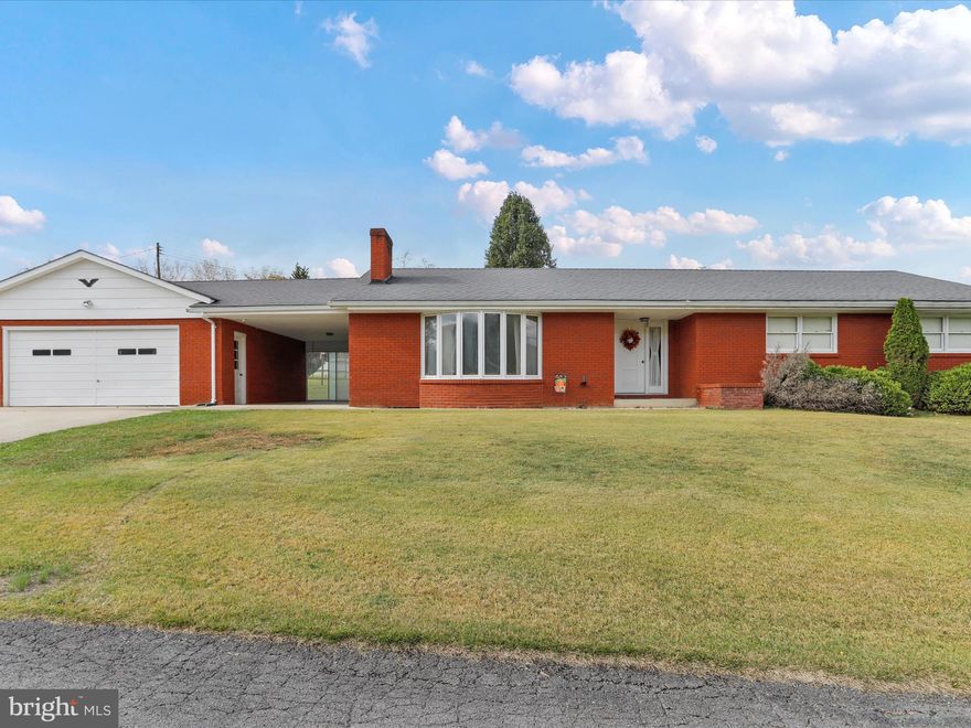 They don’t build them like this anymore. This solid brick home sits on nearly an acre right in the heart of Keyser—close to the high school, shopping, and medical services, but with the space and quiet that’s getting harder to find. No HOA. No restrictions. Just a well-built home on a beautiful lot that feels private without being remote. Inside, you’ll find over 1,650 square feet of living space with three bedrooms, two full baths, and a layout that makes sense. The living room is anchored by a stone fireplace that feels like it’s been there forever—strong, simple, and welcoming. The kitchen is bright and practical with plenty of room to work, the dining area overlooks the backyard, and the bedrooms are all comfortable in size and layout. Every corner of the home shows the kind of quality that lasts—solid doors, real trim, and craftsmanship you can still feel. A covered breezeway connects the house to a two-car garage, keeping you dry on rainy mornings and offering a great spot to sit with a cup of coffee and watch the day start. Downstairs, a massive full basement runs the entire footprint of the home—clean, dry, and ready for whatever you need: a workshop, storage, or finished space down the road. The lot itself is level, open, and almost an acre in size—big enough for a garden, a fire pit, or just a place to stretch out. There’s room here for what you need today and what you might want tomorrow. This isn’t a cookie-cutter subdivision house or a project waiting to happen. It’s a straight, solid home with good bones in a great spot—ready for someone who knows the difference between a house that’s built fast and one that’s built right. If that sounds like you, give me a call.