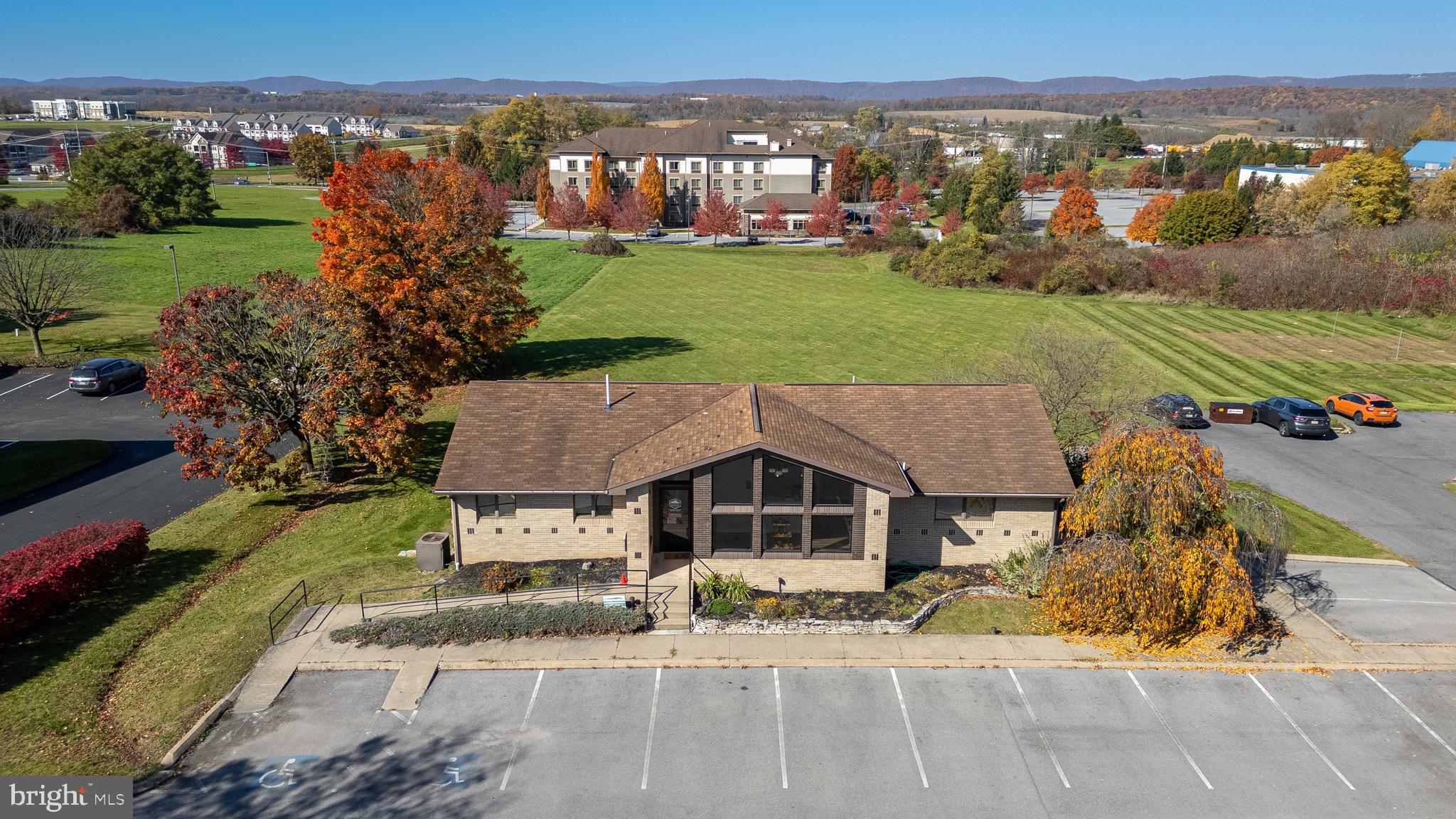 Commercial/Business opportunity off I-99, Shiloh Road Exit 76, on 2 full acres, zoned GENERAL COMMERCIAL. Highly visible, easy access property on Benner Pike between Sheetz and Tractor Supply on a flat lot and high traffic area. Existing building was built in 1989 and is in great condition OR it could be a build site for diverse commercial opportunities. Your vision is your only limitation of how this strategic location can serve your business project. Home to Penn State University main campus in College Township, this is the cradle of a growing university town and all the business and commercial expansion going on in this top ranked places to live in the USA, and top ranked Nittany Lions sports teams. There is a lessee in place with some flexibility on occupancy. This large lot backs up to the Best Western, State College, and UEC State College 12 Theatres. Lot dimensions: 150' x 560'. Located only 0.5 mi/3 min. to Nittany Mall; 0.8 mi/ 4 min to Walmart Super & Sams Club; 3.4 mi / 7 min. to Pennsylvania State University; 4.3 mi/ 8 min. to Mt Nittany Hospital, Bryce Jordan Center and Beaver Stadium.