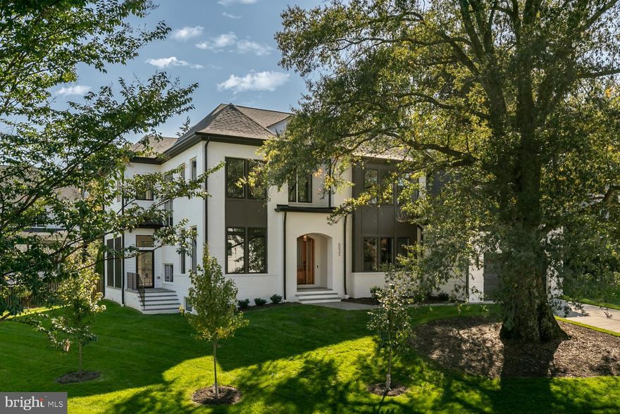 Now finished and ready to move in! Cherry Hill Custom Homes presents 6033 Corland Ct, a beautiful and timeless design in a quiet yet convenient McLean location. Prominently sited on a third of an acre in a cul-de-sac, this home features 6 bedrooms, 6 full bathrooms, and two powder rooms with 7,085 square feet of finished living space on three levels. The main level includes 10ft ceilings, gorgeous European White Oak engineered wood floors, a beautiful gourmet kitchen, Subzero/Bluestar appliances, frame-less custom cabinetry, and quartz countertops. Through the butler's pantry is a large formal dining room for an unforgettable dining experience. The great room with coffered ceiling and gas fireplace with tile surround is flanked by a large, screened porch overlooking the the spacious side yard. A private study with built-ins, a guest suite, and a mudroom with dog shower complete the main level. The upper level is highlighted by a luxurious primary suite with walk-in closet with built-ins and connectivity to the laundry room, a spa-like bathroom with heated floors, double vanities, stand-alone soaking tub, and heavy glass enclosed shower with dual shower heads, rain shower and handheld, three secondary en-suite bedrooms, and a loft area. The lower level includes a rec room with gas fireplace, full-sized wet bar with island, an exercise room, an additional bedroom with full bathroom, a media room, and a separate powder room. The home also has a built-in elevator shaft for optional conversion and irrigation system. Convenient to GW Parkway, Chesterbrook Shopping Center and all the shops and restaurants of downtown McLean. Chesterbrook ES/ Longfellow MS/ McLean HS.
