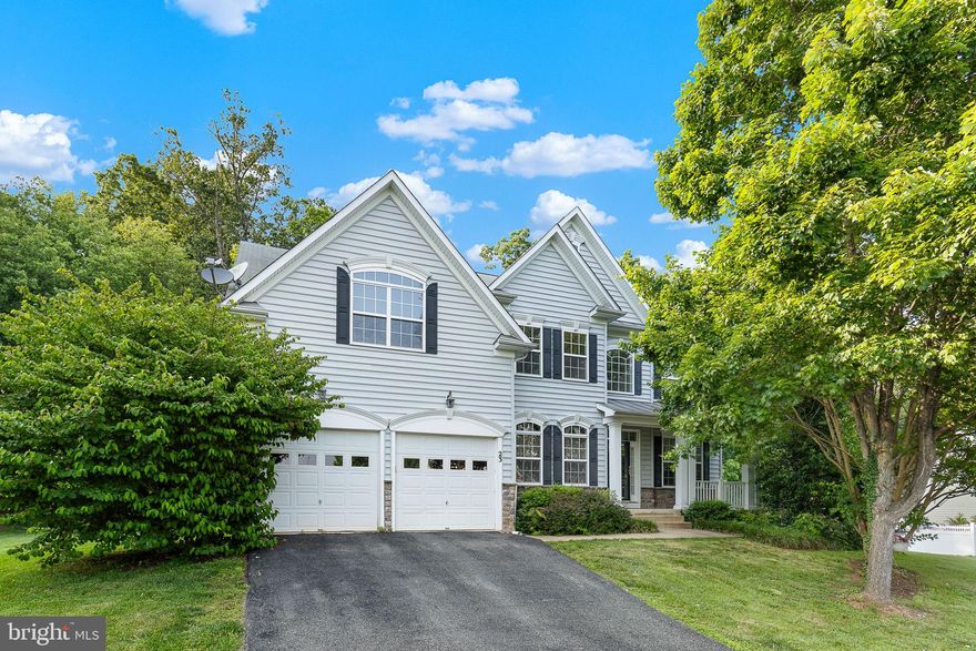 Absolutely massive, gorgeous three level, five bedroom colonial home in St George's Estates, north Stafford.  Enjoy beautiful wood floors, two-story ceilings, and massive windows allowing for tons of natural light.  Sitting on a premium half acre lot, this home is perfect for a home owner who desires plenty of space for living, working, or entertaining.  The large kitchen opens to a grand family room with two story ceilings, cozy fireplace, and huge windows that provide tons of sunlight.  The kitchen also features a double wall oven, upgraded cabinets, and large pantry.  Tons of counter and cabinet space, desk, butlers pantry, and wine rack.  Engage guests while cooking on the island stove or the bright and cheerful rear sunroom!  High ceilings also highlight the entry foyer and elegant hard wood floors flow into the formal living and dining areas.  Main level also features a large laundry room, mud room, and office behind the kitchen, useful for working from home.  The master bedroom features a sitting room, spacious walk-in closet, and ceiling fan.  In the master bath, relax in the jetted tub or the glass encased stand-up shower and enjoy the convenience of two large separate vanities.  The other two upstairs bathrooms showcase custom tile finishes, one with dual vanities and the other in a teenage suite.  The massive basement features tons of space for a recreation room, fully functioning bar, and movie theater set up for stadium seating!  The fifth bedroom and full bath also allow for in-law suite or private guest area!  Conveniently located in north Stafford, this home is minutes from grocery stores, schools, and restaurants.  Easy to commuter lanes, I-95, and Quantico.  Book an appointment to see this home now!!