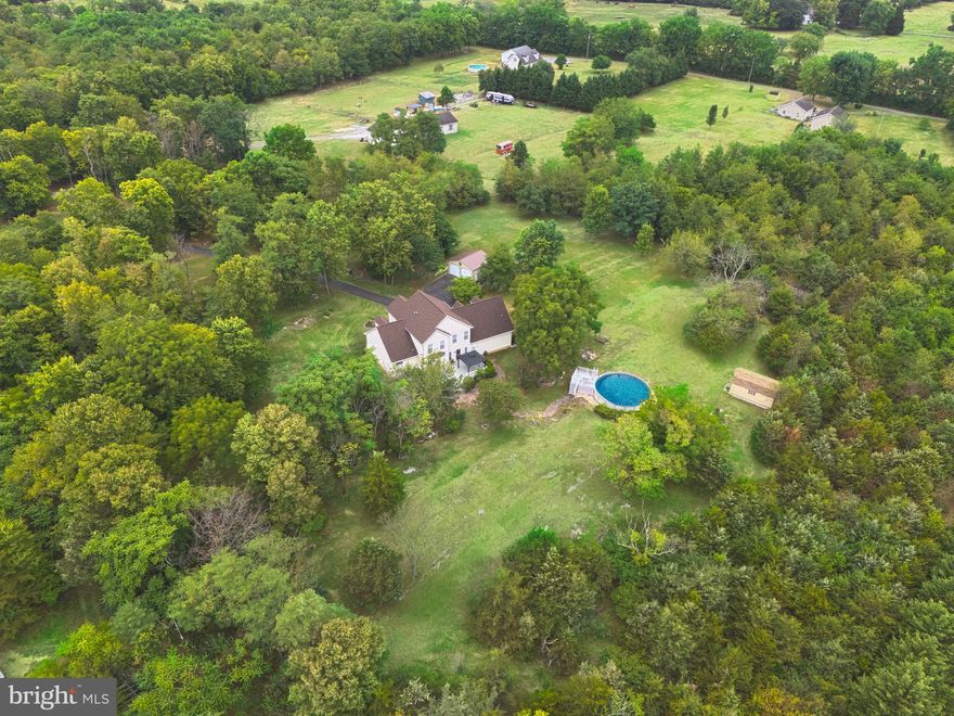 This property offers a very private lot with 5+ acres at the end of a cul-de-sac. The 2 stall oversized garage plus the detached 2 stall garage is perfect for hobbies, car enthusiasts, woodworking, hobbies and more! There is plenty of space to store a motorhome, trailer, 4-wheelers and toys. Animals are welcome.  There is a Main Level bedroom suite featuring hardwood floors, a whirlpool spa tub and dual sinks.  The updated kitchen has white cabinets, stainless appliances and a bump out filled with bright natural light perfect for a breakfast nook. The upper level has a bonus loft over the 2 stall garage providing so much extra space for an office, family room or exercise space. There are 4 additional bedrooms and a full bath across the hall.  The above ground pool is just a few steps from the back deck.  Call today for an appointment!

Accepting Back up Offers