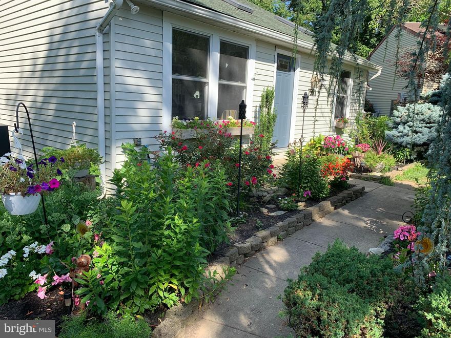 Wake up to the sound of beautiful songbirds singing outside in this garden oasis yet only minutes from the heart of historic and beautiful Frederick! The garden has been lovingly cared for and cultivated for close to 25 years now and boasts an amazing  variety of perennials (Phlox, Daffodil, Tulip Coxcomb, flowering cactus, Rhododendron, Lilac, Azalea, Peony, Japanese Maple, Weeping Blue Atlas Cedar), and even mature fruit trees and bushes (Peach, Sour Cherry, White Grape, Quince, Black Currant). 
The house has also been immaculately maintained with many new improvements and upgrades including a spectacular new Quartz Countertop in the kitchen with under mount sink, fresh paint throughout the entire house, newly sanded solid Red Oak flooring on main level, hardwood, bamboo and engineered flooring throughout house, new Architectural roof (only a few years old), new 2.5 ton super energy efficient 2.5 ton Heat Pump-AC unit with Air Handler, 3 operable Velux Skylights, Jetted Whirlpool Tub in Master Bathroom and much more! House also has many energy efficiency upgrades including extra insulation and the new Heat Pump and is officially listed as a "certified energy power saver" home! In addition there is a real wood burning fireplace on the main level that adds a lot of coziness, ambiance and heat on cool Fall and Winter days and evenings!
In addition the current owners have run an award winning and highly sought after 5 star Airbnb out of the lower 2 levels of the home all while living in the upper 2 levels. (The signed guest book is available for viewing if interested!) The Airbnb has been primarily run on the weekends and has brought in an average of $10-12,000 per year only on a part time basis and if the entire home would be used as an Airbnb, the amount of possible income would obviously substantially increase! The owners would also prefer to sell some or even all of the existing furnishings at a price to be agreed upon at a later date which would make the property and ideal turnkey Airbnb or a beautiful home for the new owners!
The cul-de-sac dead end street and location is very safe and quiet and surrounded by wonderful and friendly neighbors! 
In short, this is a unique and very interesting property and a great find in the heart of historic and beautiful Frederick with the feel of living in the country!