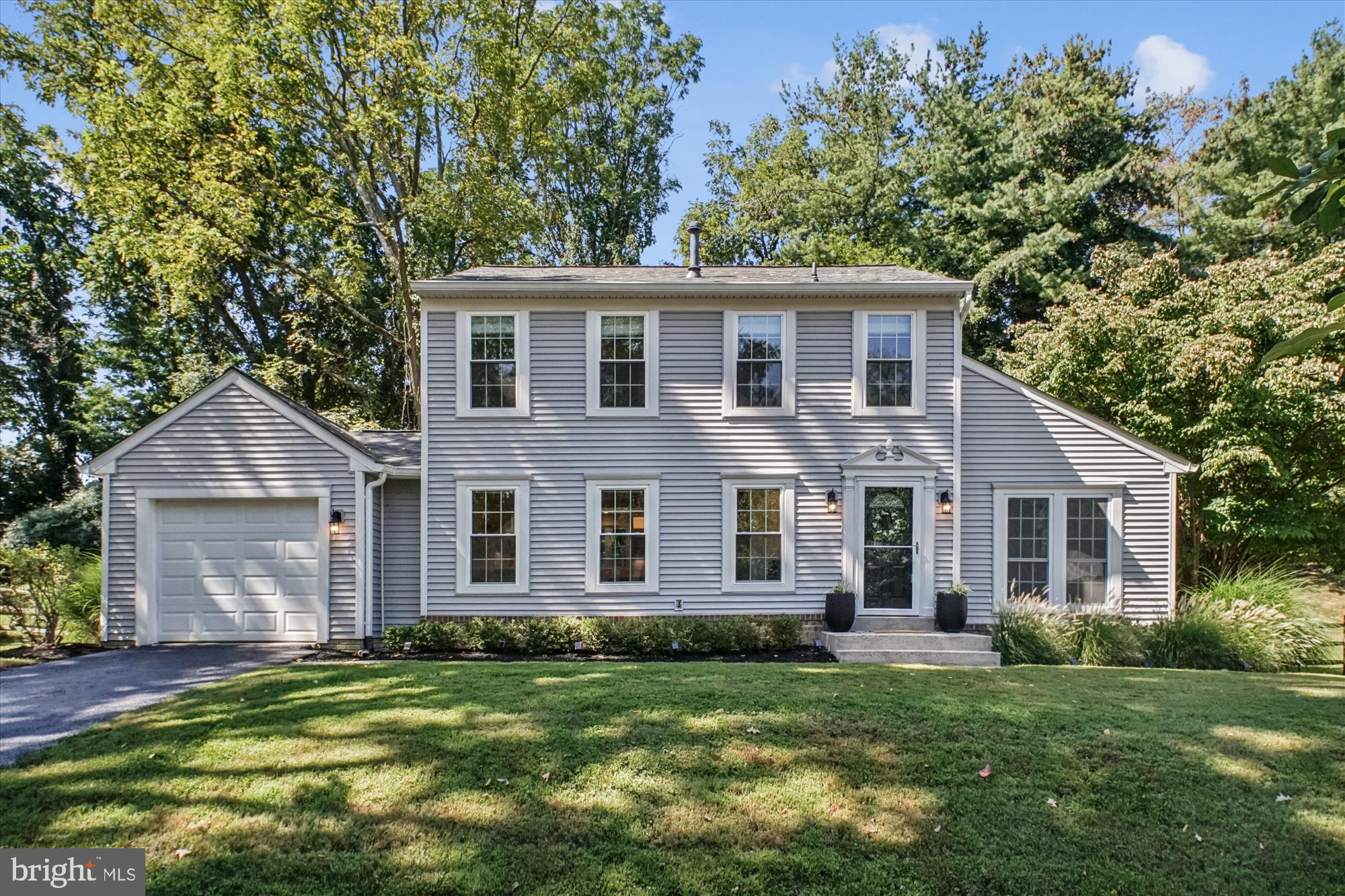 Discover 1058 Pipestem Place—a beautifully renovated modern colonial nestled on a quiet street in Potomac’s highly desirable Fallsmead neighborhood. Situated on a quarter-acre lot, this home features three finished levels with three bedrooms (with an easy option for a fourth), three full bathrooms, a powder room, and an attached garage.
Outside, the property underwent a comprehensive exterior renovation in 2017, including a new roof, energy-efficient windows, gutters and downspouts, durable vinyl siding, and added attic insulation. A new HVAC system was installed in 2019 for year-round comfort.
Inside, you’ll find a bright and inviting interior with maple hardwood flooring throughout the main and upper levels, enhanced by abundant natural light. The open main level seamlessly connects living spaces and showcases a gourmet kitchen with custom Thomasville cabinetry, quartz countertops, a five-burner gas range with hood, peninsula seating, stainless steel appliances, under-cabinet lighting, and a subway tile backsplash. The living room is perfect for relaxation and entertainment, offering a vaulted ceiling, recessed lighting, a wall-mounted TV and sound system, and a modern fireplace with adjustable color and heat settings. A convenient powder room, coat closet, and direct access to the attached garage add to the home’s functionality.
Upstairs, the owner’s suite is a true retreat with recessed lighting, crown molding, a walk-in closet with custom built-ins, and an en-suite bathroom featuring sleek tile finishes, a quartz vanity, and a glass-door shower. Two additional bedrooms, a full bathroom, and a linen closet complete the upper level, providing ample space for family or guests.
The fully finished lower level offers resilient LVP flooring, recessed lighting, a full bathroom, and a laundry/utility room. This versatile space is ideal for a playroom, home gym, office, or lounge area, easily adapting to your lifestyle needs.
The expansive, fully fenced backyard is professionally landscaped and features a French drain and a stunning bluestone patio—perfect for outdoor gatherings and summer barbecues.
Fallsmead is a vibrant community centered around its private 17-acre park with a serene lake and an extensive network of both paved and wooded trails. Residents enjoy access to a swimming pool, tennis and pickleball courts, a playground, picnic tables, meadows, an open field for soccer, and a large grassy playing field, all surrounded by these scenic trails. The community hosts regular social events such as movies in the park, July 4th pool parties, happy hours, and is home to the Fallsmead Sharks swim team—fostering a strong sense of camaraderie and active living.
The street features dedicated sidewalks and is near multiple public transit options, providing easy access to commuting routes.
Located within a short distance of top-rated Montgomery County schools—including Fallsmead Elementary, Robert Frost Middle, and Wootton High School—and offering convenient access to I-270 and local amenities, this home provides the perfect blend of comfort, convenience, and community. Don’t miss your chance to experience exceptional living in one of Potomac’s most sought-after neighborhoods.