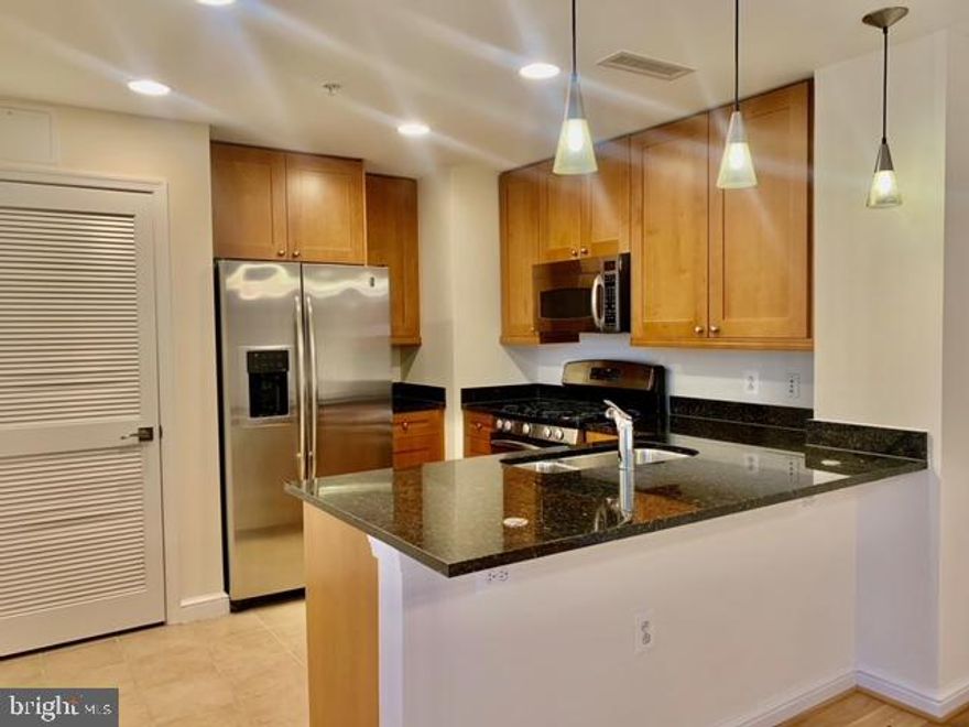 Luxury Living 21-story Midtown Condo in the heart of Reston Town Center. Sunny & Bright 1BR+1Den with Large Private Balcony overlooking Pool and Outdoor Terrace. Den can be used as 2nd BR or office with great views! Gourmet Kitchen w/ Granite Counter Top, Hardwood Floor, 9' Ceiling and Garage Parking. Gas, Water & Sewer included in rent. Amenities include 24HR Concierge, Valet, Outdoor Pool, Party Room, Business Center, Meeting Room, Media Room, Gym, Guest Suite and Terrace with Gas Grill and more. Amazing Location! 10 mins to Dulles Airport, easy walk to Shops, Restaurants, Theater, and Reston Metro.