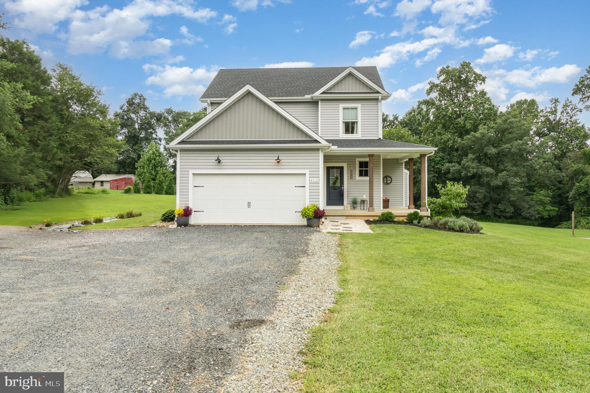 This custom-built home by Taylorbilt Homes, completed in 2021, offers a rare blend of thoughtful design, quality craftsmanship, and peaceful surroundings on 2 acres in the North Harford school district. Inside, the kitchen stands out as the heart of the home—featuring Kraftmaid floor-to-ceiling soft-close cabinetry, Borghini Avanti quartz countertops, a Frigidaire Gallery appliance suite, and an oversized island ideal for gathering and entertaining. The open layout is complemented by durable, water- and scratch-resistant Cortec Calypso Oak flooring, a cozy gas fireplace, and Andersen windows and doors that bring in abundant natural light.
The spacious primary suite includes a well-appointed en suite bath with double sinks and a generous walk-in closet. Two additional bedrooms and a stylish hall bath offer comfortable accommodations, while a flexible space on the lower level can serve as an oversized pantry, home office, or extra storage—whatever suits your needs. The large, unfinished basement also features Superior Walls by Weaver Precast and a rough-in for a full bath, providing endless possibilities for future living space.
A brand-new Trex deck, completed in August 2025, provides an inviting space to enjoy the private backyard, where you can often spot deer, birds, and other local wildlife. Just minutes from Broad Creek, the location offers the serenity of nature with convenient access to nearby outdoor recreation.
Additional highlights include a two-car garage with extended parking, sprinkler system, 2024 water heater, and exterior upgrades installed by Tar Heel Construction—including GAF architectural shingles and siding with transferable manufacturer warranties. This is a turnkey opportunity to own a beautifully designed home in a scenic and highly sought-after location.