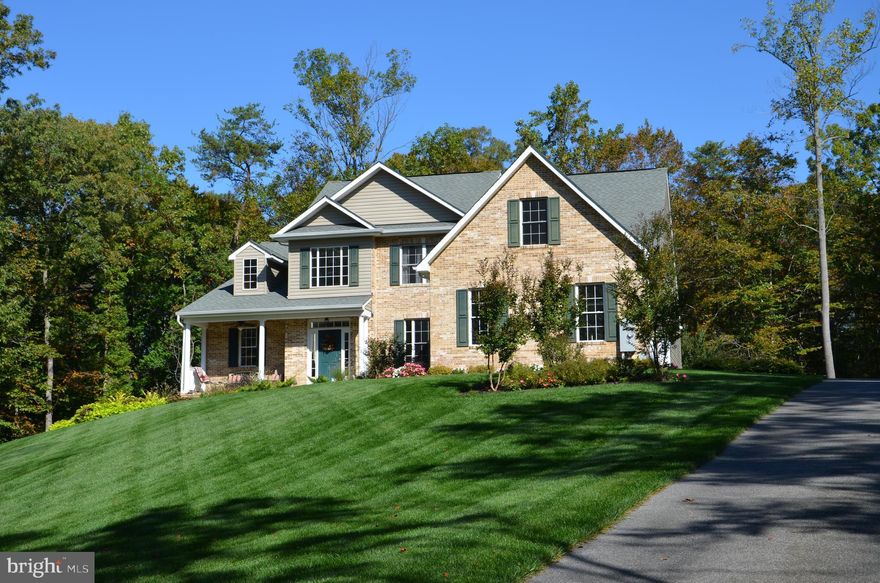 THIS HOME IS TO DIE FOR!!!That is only one way to describe this lovely home! It has been very well cared for! 2  Kitchens, 2 Laundry Rooms, 3 CAR SIDE LOAD GARAGE, triple Zone HVAC, Hardwood Flooring, Upgraded Kitchen, and so much more - Read on -  Very Nice IN-LAW Suite in the Lower Level with separate entrance and Open Floor plan with Full Kitchen, its own Laundry and Storage and Large Bedroom with Full Bath.  The Main part of the house features a Newly Updated Kitchen with Quartz Counter tops, Stainless Steel Appliances, All new Cabinets, and so many other features like a drawer for your coffee pods.  Open Family Room with Gas Stone Floor to Ceiling Fireplace, plenty of natural light, Open Dining Room, Hardwood Flooring on the Main Level, Master Bedroom on Main Level with Full Bath and Walk In Closet, A second Bedroom/Office on the Main Level next to Full Bath, Laundry Room and Garage.  Walk on the deck from the kitchen for easy entertaining.   Second Level offers 2 Bedrooms and a 3rd Room to be used as a Bedroom, TV Room, Rec Room, whatever you want.  Second level opens to the main level.  If you like an open floor plan this is it.  AWESOMENESS is just not for the inside, the yard is private and full of bushes and flowers for each season.  The awesome Fire Pit Patio area is a great place to entertain or just relax and enjoy the scenery.  2 Sheds, Screened in patio with stamped concrete, Long private paved driveway, and Privacy.  This property has so much to offer.  Don't wait on this one.  It could be yours.  BUY THIS HOUSE NOW !!!!!