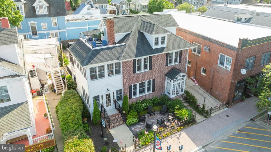 Downtown Lewes Gem – Live, Work & Thrive in the Heart of the Historic District.  A once-in-a-lifetime opportunity awaits on iconic Second Street in downtown Lewes—Delaware’s most charming coastal town. This meticulously rebuilt mixed-use property, with over 3,600 sq. ft. of finished space, blends 100 years of history with modern convenience, offering the perfect balance of lifestyle, location, and investment potential.  Located in the heart of the commercial district, this beautifully renovated property features a spacious residential home above a premium first-floor office space—ideal for entrepreneurs, professionals working from home, or investors looking to maximize rental potential.  Live upstairs, work or lease downstairs, or enjoy the entire building for yourself.  With over 2,000 sq. ft. of finished living space across the second and third floors, the residence includes 3 bedrooms, 2 full bathrooms, gourmet kitchen with quartz countertops, sunroom, exposed brick walls, elevated deck, and a third-floor balcony offering sweeping views of historic Lewes. Downstairs, the 1,500 sq. ft. office space is move-in ready and perfectly positioned for visibility and access on one of Lewes’ most desirable streets.  Everything has been thoughtfully rebuilt from the studs up—new roof, windows, electric, plumbing, HVAC, and owned solar panels—all while preserving the timeless charm of this classic home.  The fenced front courtyard overlooks bustling Second Street, putting you steps away from fine dining, boutiques, the canal, and Lewes Beach. A private concrete parking lot, detached brick garage, and basement add convenience rarely found downtown.  Whether you're looking to combine your business and lifestyle, start a new venture in a premier location, or simply enjoy downtown Lewes living, this property delivers.  There is even room to expand. Plenty of room to add a pool and still have parking in your private driveway.   Only three owners in over a century. Opportunities like this are rare. 📍 Prime Second Street address 🏡 Mixed-use zoning in commercial district ✅ Fully renovated, turnkey ready 🚗 Private parking + garage 🌞 Owned solar panels 📜 Sellers are licensed Delaware REALTORS®. Schedule your private tour today—and secure your place in the heart of Lewes.