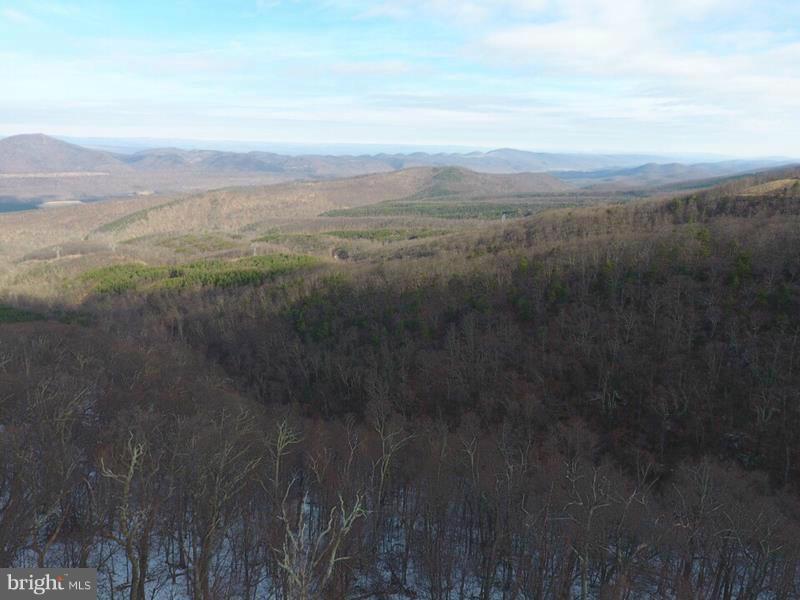 A COMPLETE 180! 32 WOODED ACRES ELEVATED AT 2500 FT WITH INCREDIBLE 180 DEGREE VIEWS ON THE NORTHERN SLOPE OF SOUTH BRANCH MOUNTAIN. GREAT PERKED BUILD SITE WITH EASY ACCESS & ELECTRIC, MINIMAL TREE CUTTING TO ACHIEVE FULL VIEW. 2 RIDGES ON THIS LOT, EASY TO MAKE ATV TRAIL FROM END TO END. HUNT FOR BUCKS & BEAR ON YOUR OWN LAND OR DRIVE 2 MILES TO PRIVATE ACCESS TO 10,000 AC OF STATE GAME LAND!
