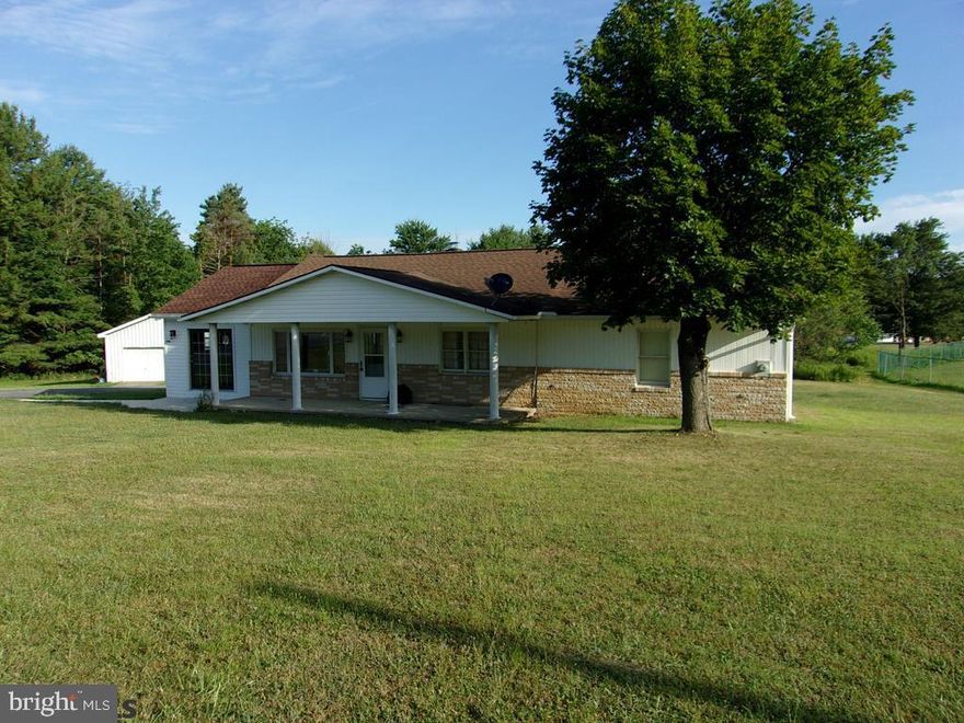 Exceptional ranch home with many living style options. Beautiful oak kitchen with granite counter tops. Open floor plan to the living room with cathedral ceilings. 3 bedrooms or could be a large master bedroom suite. 2 large garages with the biggest being 40x60.  all set on 2.56 acres