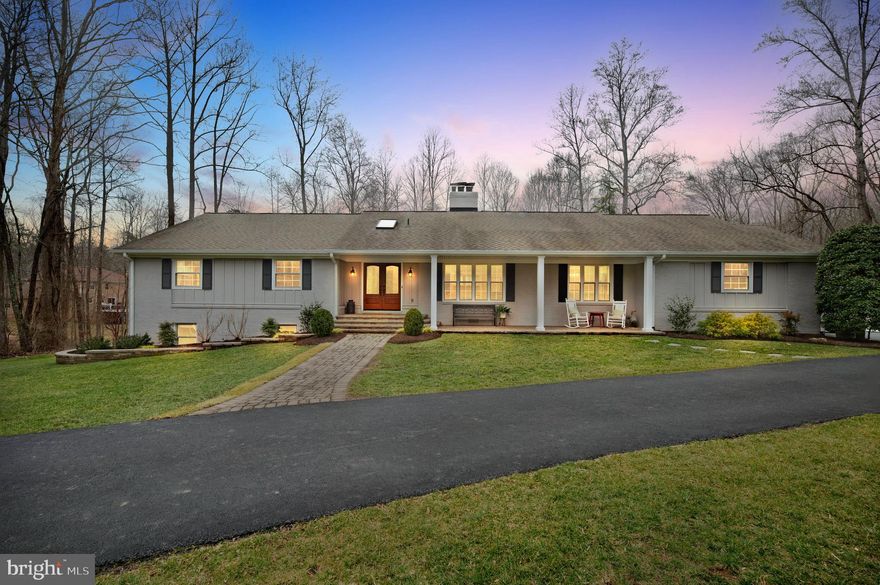 You can’t miss this spectacular 6 bedroom, 3.5 bath home on over 5 acres in Fairfax Station! Drive up the circular driveway and notice the exterior covered in recently installed Hardie siding (2021) while a beautiful front porch welcomes you to the large double front doors. Upon entering the home you will encounter sparkling hardwood floors throughout the main living area. The home radiates with natural light thanks to the skylights and recently updated windows (2021). The kitchen boasts a brand-new double oven, quartz countertops, a farmhouse sink, and gleaming stainless steel appliances that make cooking and entertaining a seamless experience. Right off the kitchen, you have easy access to a bright and spacious laundry room. The numerous bedrooms give you plenty of options to utilize each space as needed. The primary bedroom includes an en suite bathroom as well as a private walk-out to the back deck. The walk-out lower level provides 2 additional bedrooms as well as a full bathroom that was fully renovated in 2022. The expansive backyard features a brand-new, heated saltwater pool (2022) and plenty of space for entertaining. The home is surrounded by a beautiful wooded area complete with its own peaceful creek. Recent updates include a new water filtration system (2021) and new gutters/gutter guards (2021). The roof was last replaced in 2015 and has 30-year shingles. Make this turn-key home yours today!