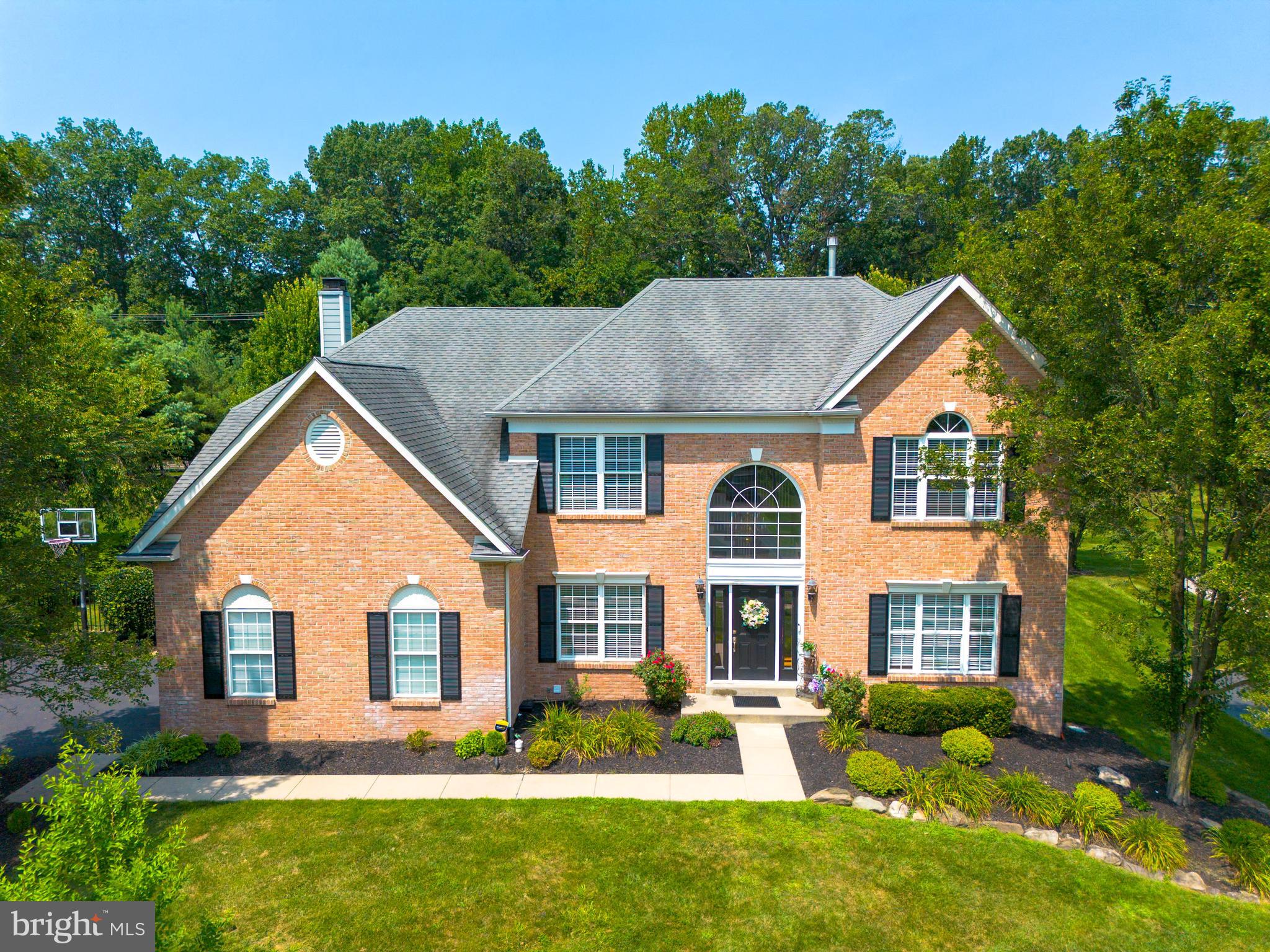 Wonderfully impressive Executive level colonial four bedroom 3.5 bath single family home in the award winning Central Bucks School district. Walk in to the two story foyer where the sun gleams off the hardwood floors. The living space to the right and office / multi- use room to the left straight ahead the main stair with chandelier. The formal dining room being off the kitchen and just beyond the living room provides a great space for Sunday dinners, holiday entertaining and even the larger family regular meals will be well enjoyed here. The kitchen is open, newer stainless appliances, wonderful hardwood cabinets, granite counter tops and additional center island for prep or quick bites. Table space just next to the sliding doors is perfect for the smaller quick meals with a great view to the backyard and pool. The family room continues full view from the kitchen with great natural light coming in through the plantation shutters. Fireplace at the center making for a great cozy atmosphere on cold winter days. Half bath, garage door, laundry room with mud room at the side door just off the family room. The upstairs spacious hall leads to 3 healthy sized bedrooms with hall bath and the other end the primary bedroom has a vaulted ceiling, amply spaced bed area and newly added dressing space that leads to the two walk in closets, primary bath with soaking tub, double sinks and shower stall. The finished basement includes large open space for family down time and has a multi use room for your choice as a temp guest room or office the basement also has a full bath. This home is protected with fire sprinklers for upmost peace of mind. The backyard is manicured with in ground salt water pool fenced for safety and has a shed for pool and outdoor equipment. When having parties there is no problem parking with space for up to 6 cars as well as street parking. This is your next home for great family memories put your offer in soon.
