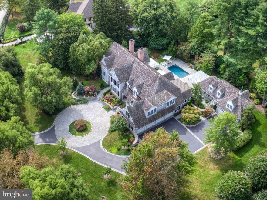 Exceptional Main Line estate property set on one and a half private acres in the heart of Radnor Township. This stunning 11 year old Vaughn built home exemplifies Main Line luxury living with extensive amenities, millwork, and beautiful finishes. This captivating property includes a pool, pool/guest house with full gourmet kitchen with a wall of doors opening to pool area, laundry, changing area, full bath, additional two car garage and bedroom and sitting room on second floor. This impressive property also includes: chef's kitchen with large marble island and sunlit breakfast room, opening onto family room with coffered ceiling and fireplace, large mudroom, butler's pantry with nice sized dining room and large sun-filled living room with fireplace, first and second floor laundry, distinguished study with built-ins and cabinetry, formal and informal powder rooms, and exceptional views of the pool, patio and mature professional landscaping throughout every room. The second floor includes: spacious landing, serving as nice sitting area, or homework area, large vaulted master suite with his and her bathrooms, walk in closets, upstairs sitting room, and deck overlooking pool, and four additional large ensuite bedrooms. Fabulous spacious sun-filled finished lower level with kitchen, family room with fireplace, temperature controlled wine cellar, billiards area, gym area and full bath. All this and a covered porch, stone patio, circular drive, a total of six garages, award-winning Radnor schools and all the wonderful amenities Bryn Mawr has to offer.