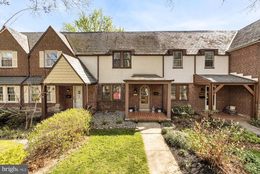 Travel down Lake Avenue, where towering sycamore trees stretch overhead, forming a canopy above parallel rows of storybook Tudor Revival homes. No two are quite the same…which is exactly what makes 705 E Lake Avenue feel so special.

There’s a quiet kind of magic here, tucked beneath the trees along this charming stretch of Lake Walker. Step through the sweet arched doorway and into a bright living space with original inlaid floors and a decorative fireplace. The layout flows easily into a spacious dining area, with an adorable bar tucked just off to the side. At the rear, the kitchen opens to a quaint backyard…perfect for morning coffee, evening unwinds, or space for an extra happy pup.

Upstairs, you’ll find three comfortable bedrooms and a full bathroom with a gleaming skylight, while the lower level offers additional living space and a second full bath…ideal for guests, a cozy den, or a home office.

Recent updates include a brand-new furnace (2026), a brand-new water heater (2026), updated plumbing in the upstairs bathroom , replaced the flat roof (2024), electrical updates including a 200 amp electric panel, refinished hardwood flooring in the first floor (2023), fresh paint throughout, and more.

All just moments from Belvedere Square and neighborhood favorites like Swallow at the Hollow, The Charmery, and The Senator Theatre.

This is a rare opportunity to call one of Baltimore’s hidden gem neighborhoods home, where timeless charm and everyday convenience come together effortlessly.