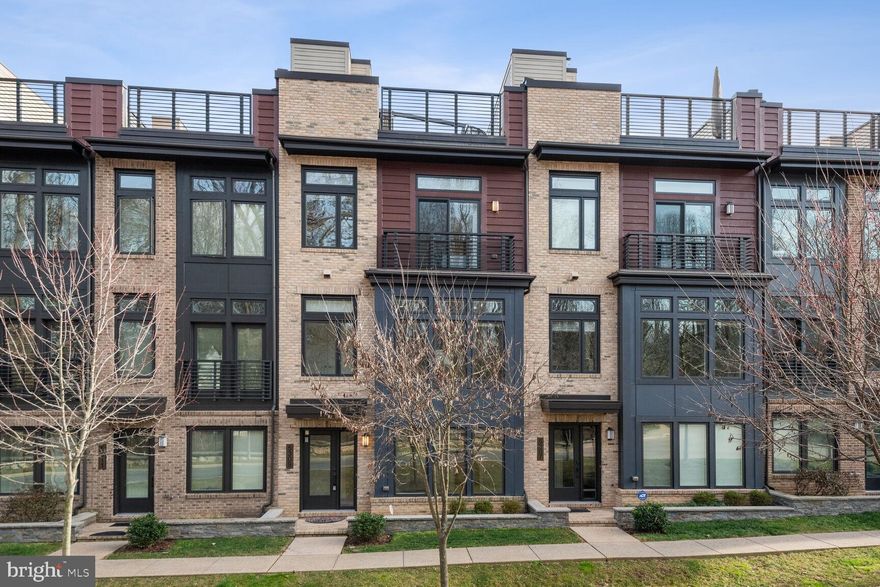 OPEN SUN 3/24, 1-3PM!   Don’t miss this opportunity to own a 4 level luxury EYA elevator townhome in
the serene Grosvenor Heights community.  From the glass entrance way to the high-end touches, this 2015- built, 4BR 3.5BA sunlit home is filled with modern elegance.  The entry level features a bedroom or flex office 
space with a en-suite full bathroom, an ELEVATOR  servicing all 4 floors and access to the rear loading 2 car garage.  The main level boasts floor to ceiling windows, a sleek gourmet kitchen with rich, dark cabinets, 
stainless steel appliances, a massive island, a large pantry, an expansive living room/dining room with a stunning gas fireplace and a powder room.   On the 3rd level you’ll find the owner’s suite, complete with a walk-in closet and a luxurious primary bathroom with double sinks and an exquisite black tiled shower.  The 2 secondary bedrooms, with large windows and spacious closets are just down the hall. The laundry, paired with a utility sink, is also conveniently located on the 3rd level.   The spectacular rooftop terrace, accessible by both the elevator and the stairs, will become your favorite spot to entertain or relax.  With a spectacular
stone fireplace, Brazilian teak tiles, steel black railings, and a retractable awning, this enormous rooftop is perfect for any occasion.  Grosvenor Heights is conveniently located to shops and restaurants, steps from Wildwood Shopping Center and minutes from Downtown Bethesda, Pike & Rose, D.C., Strathmore Music Center, the Metro Station, I-270 & 495. Become a part of the Grosvenor Heights community today!