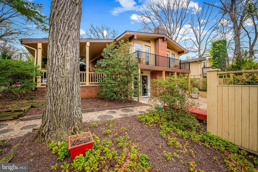 Maxalea, located just steps from Stoneleigh and within walking distance to Stoneleigh Elementary School, is a neighborhood of 22 mid-century modern homes. This rare model has four true bedrooms and two and a half baths, with over 2000 square feet of living space. Outdoor patios and balconies provide great exterior entertaining spaces, while the open floor plan of the living area creates the quality time and cohesion you desire. The primary suite offers access to the balcony, a full bath, and a wall of closets. Plus, there's an access door to an adjoining bedroom, making a home office easy and functional. The second full bath on the upper level is dedicated to the three remaining bedrooms, although the primary bath can be accessed via the bedroom that makes a great office. The kitchen and living spaces were renovated by Turner Troxell. Enjoy that hardwood flooring, new composite deck from 2024, new roof 2019, new boiler 2019, and more. The fish pond offers hours of enjoyment.  Parking pad accessed from Banbury Road.