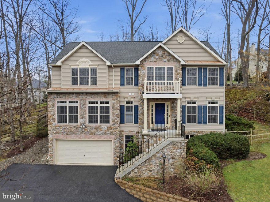 Welcome to the lake life! This beautifully maintained, 2007 Colonial, checks all the boxes. Offering over 3,300 sq. ft. above grade square footage, a seamless floor plan and lots of natural light, this home is sure to please even the most distinguished buyer. Enjoy seasonal lake views, elegant architectural details, and a spacious, open floor plan designed for comfort and entertaining. A grand two-story foyer, 9 ft. ceilings, double entry, and triple crown molding set the tone as you enter. The main level features formal living and dining spaces, a generous family room, and a dedicated library/office anchored by a double-sided propane fireplace. The gourmet kitchen includes cherry cabinetry, granite counters, a large island with breakfast bar, stainless steel appliances, and a large walk-in pantry—flowing seamlessly to the screened-in porch with Trex decking and ceiling fan. Upstairs, the grand primary suite boasts cathedral ceilings, an oversized walk-in closet, and a luxury bath with upgraded glass shower and soaking tub. Three additional bedrooms, including a Jack-and-Jill bath, and convenient upstairs laundry complete the level. The basement features a generous drop zone/small finished space, directly off of the oversized 2 car garage. So convenient for shoes, coats and any indoor/outdoor items. The real gem on the lower level is the expansive unfinished space. The sky is the limit with the possibilities. Imagine the future entertaining space, Game room, theater, playroom or additional storage space you could have. Back outside this home offers plenty of parking (a rare find in Lake Linganore), extensive hardscape with an outdoor oven, pergola, and thoughtfully added drainage around the property. The fenced yard (2018) backs to a non-buildable lot, offering added privacy. This home is meticulous. Located in the sought-after Lake Linganore community with access to lakes, trails, pools, and recreation—this home blends space, style, and setting in one exceptional package.