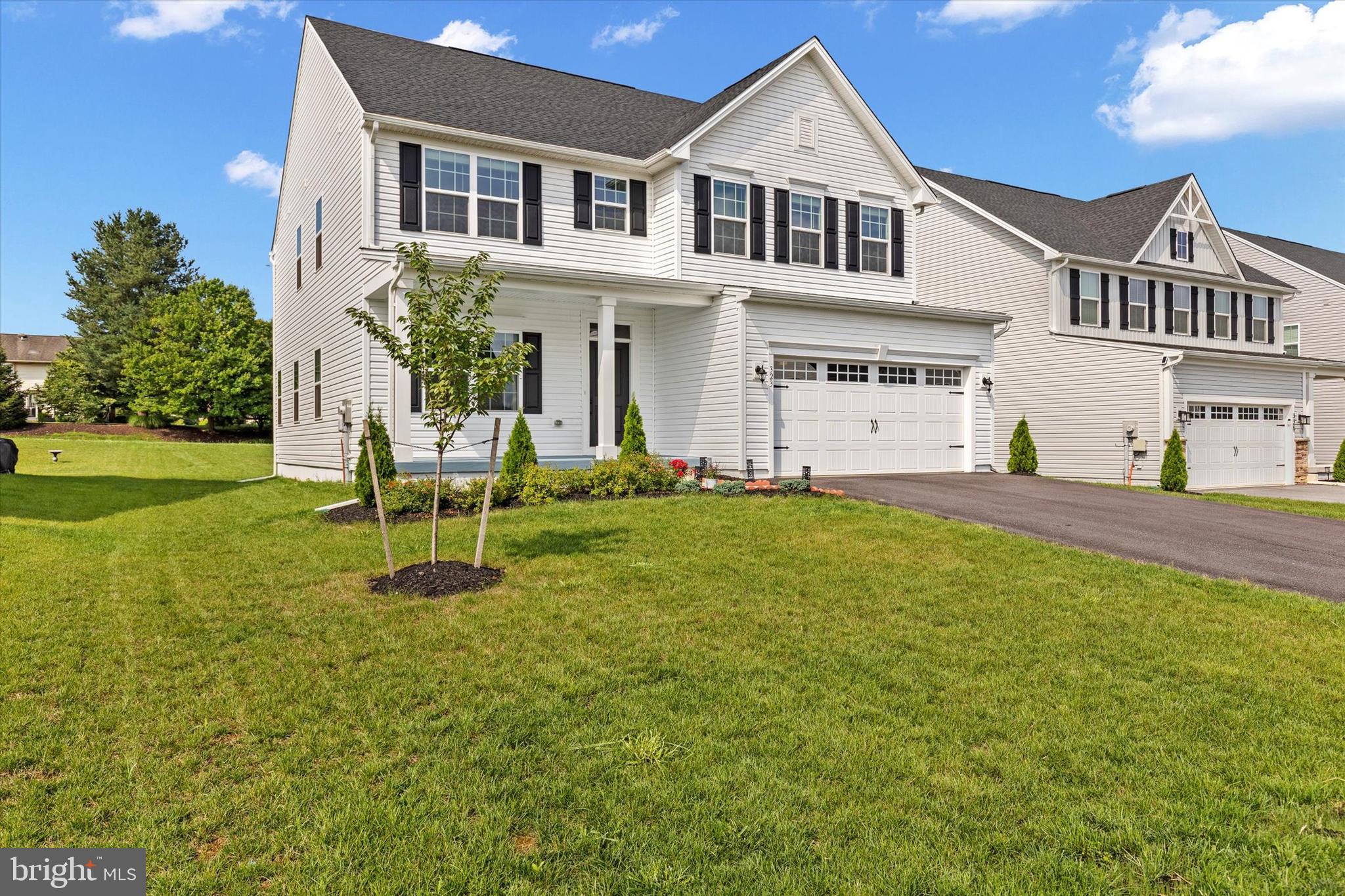 Why wait for new construction? Move into this fully upgraded, turn-key Hudson model today—schedule your private showing!
Built in March 2024, this stunning 5-bedroom, 4-bath Ryan Homes Hudson model in Green Lane Meadows offers 3,571 SF of fully finished space with thoughtful upgrades throughout. The main level features a private study with double doors, a guest bedroom with a full standing-shower bath, and an upgraded gourmet kitchen with quartz countertops, soft-close cabinets, Samsung Bespoke smart refrigerator, and LVP flooring. Upstairs, the luxurious owner’s suite includes a jacuzzi tub, walk-in shower with bench, dual vanities, and a custom walk-in closet, plus three additional bedrooms, a spacious dual-sink bath, and a laundry room with high-tech Samsung washer and dryer. The fully finished basement includes a full bath with standing shower and ample recreation space. Additional highlights include matte black hardware, ceiling fans in key rooms, recessed lighting, custom roller blinds, a covered front porch, upgraded staircase, rear yard steps, and a Culligan whole-house water softener. Located in the desirable West Shore School District, this move-in ready home blends comfort, style, and modern convenience.