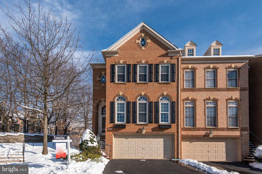 Huge 4-level townhome that lives like a single-family home! End-unit townhouse with endless number of upgrades.  This home offers tons of natural light, hardwood floors on 3 levels, gourmet kitchen w/ granite countertops and double wall ovens, expanded deck w/ built-in flower boxes, heavy crown mouldings throughout, finished basement with a wet bar and bathroom, and a large loft perfect for an office, home gym, or a tranquil retreat. Tons of storage options! Luxury master suite - tray ceilings, separate tub and shower. A commuter s dream! Centrally located with easy access to many major highways and public transportation.